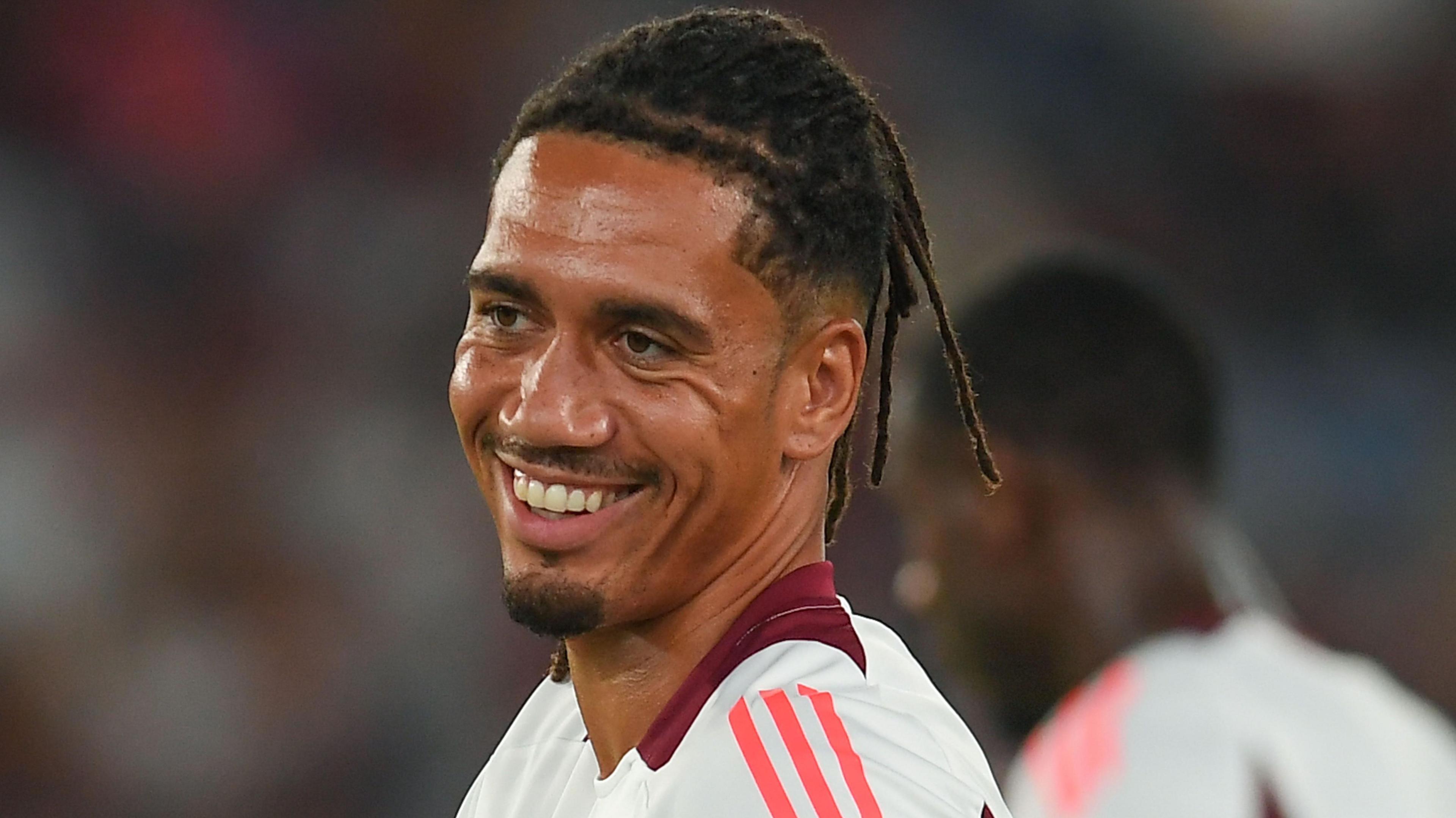 Chris Smalling smiles while playing for Roma