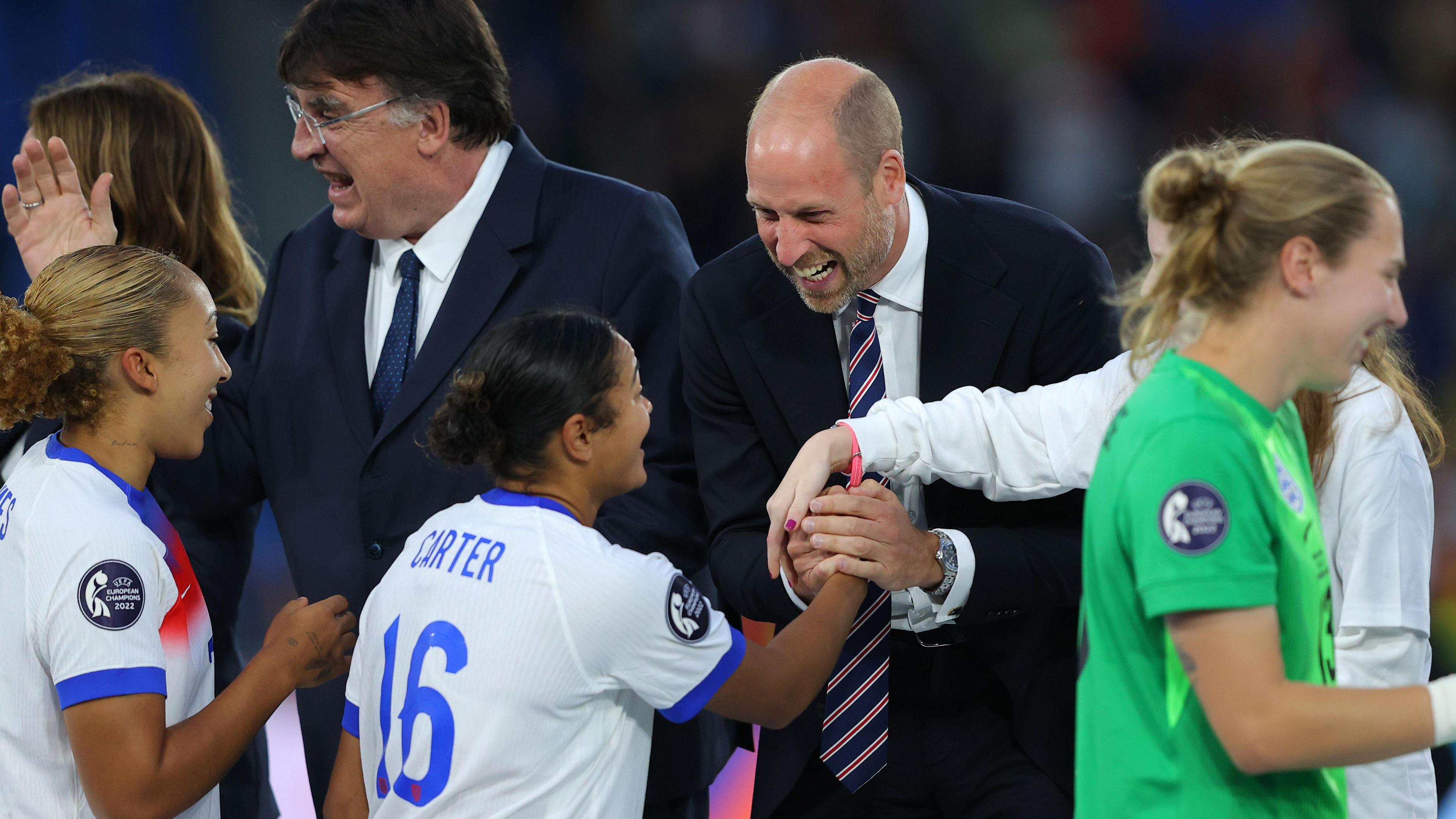 Jess Carter celebrates with the Prince of Wales
