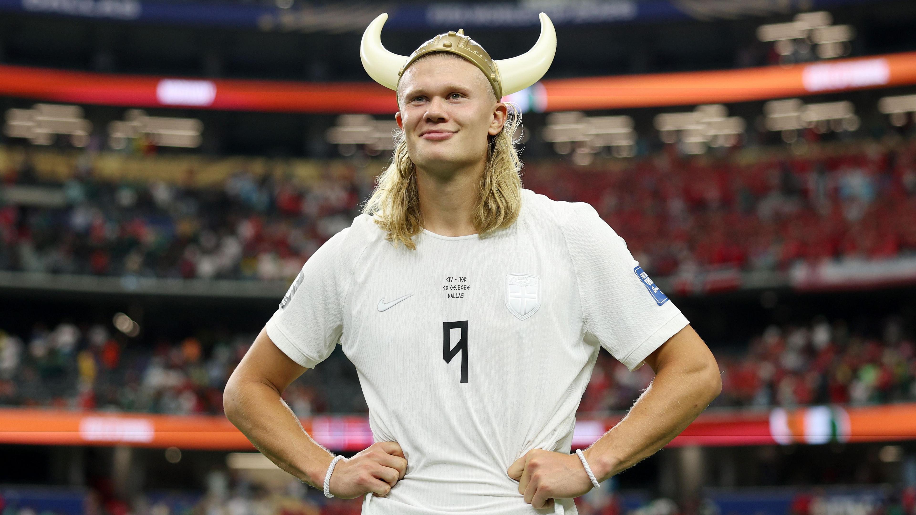 Erling Haaland wearing a plastic viking helmet after Norway beat Ivory Coast