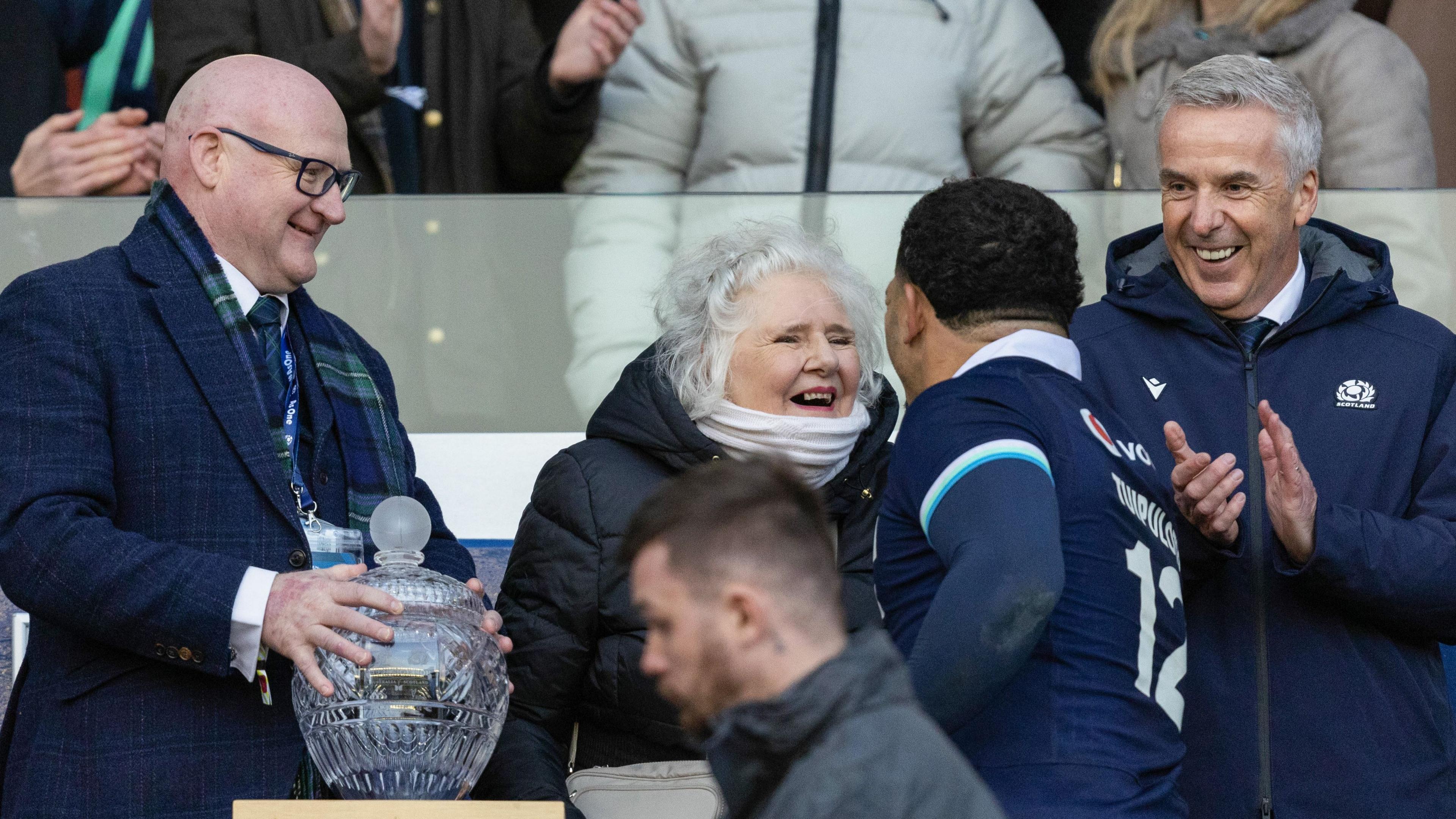 Sione Tuipulotu talks to his grandmother Jacqueline 