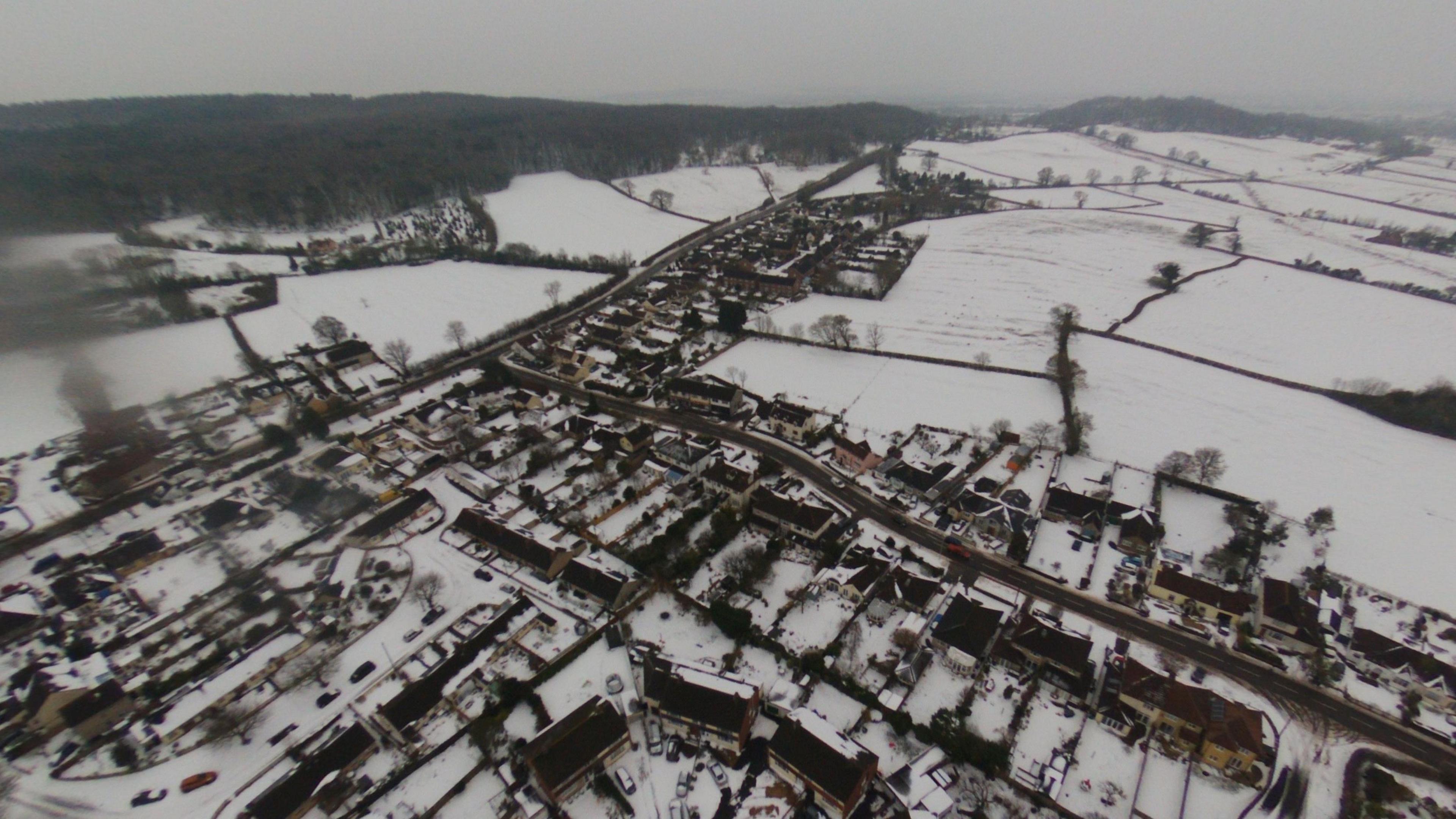 An aerial photo showing a village in North Somerset, with lying snow everywhere under low, grey skies. This was during the so-called ‘Beast from the East’ episode of extreme cold and extensive snow into early March 2018.