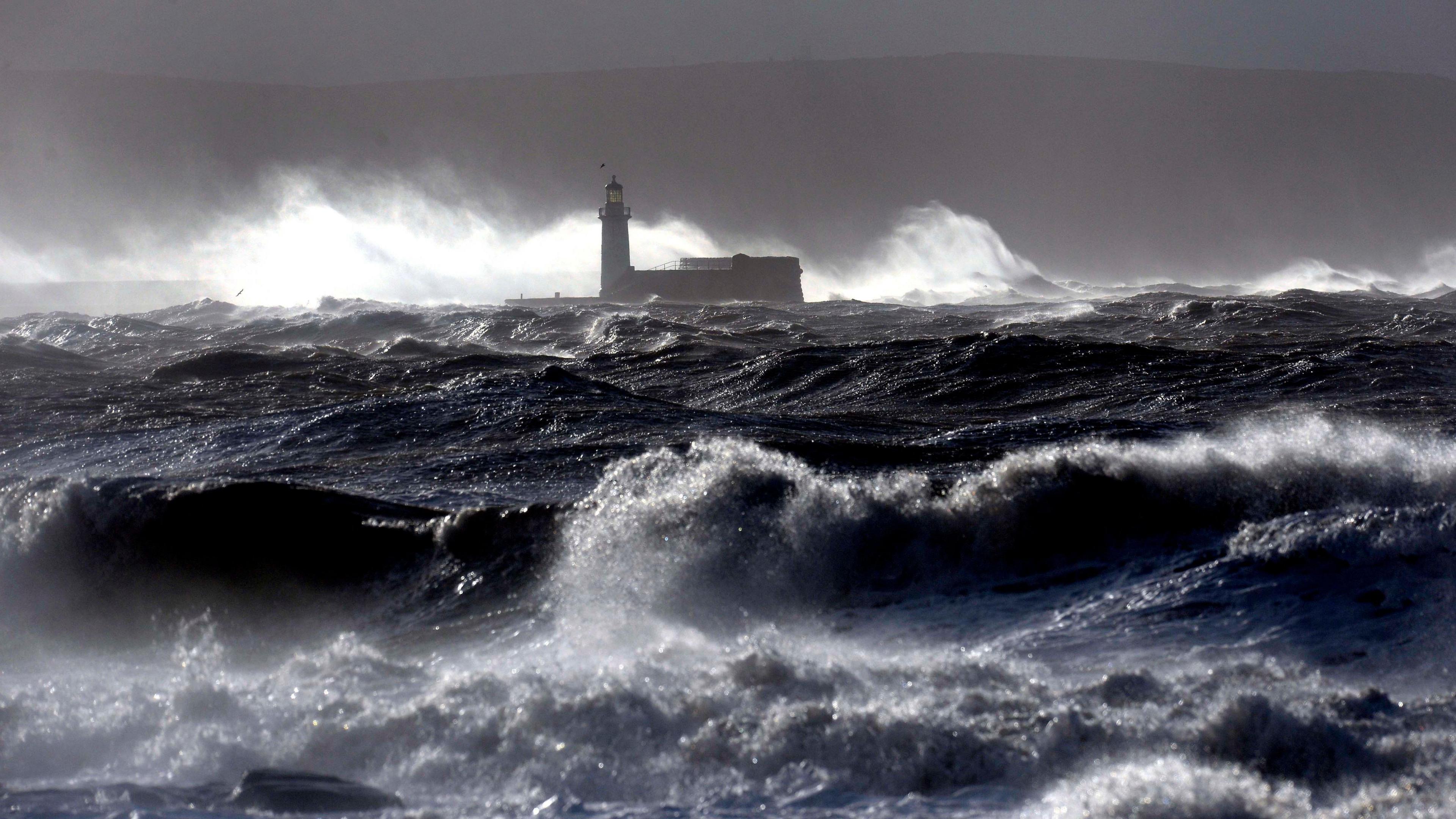 Giant waves hit the lighthouse wall at Whitehaven during a storm in 2014.