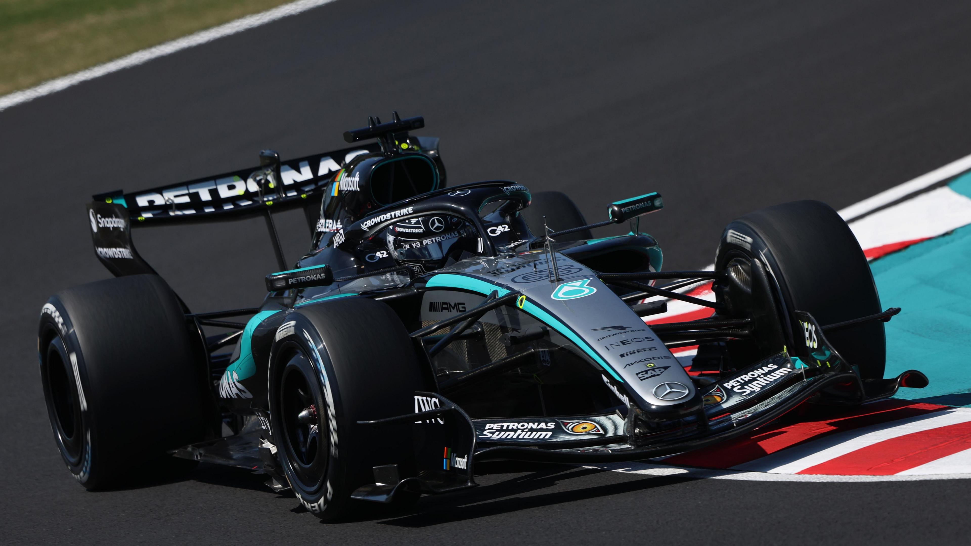 Mercedes' George Russell goes round a corner during first practice for the Japanese Grand Prix