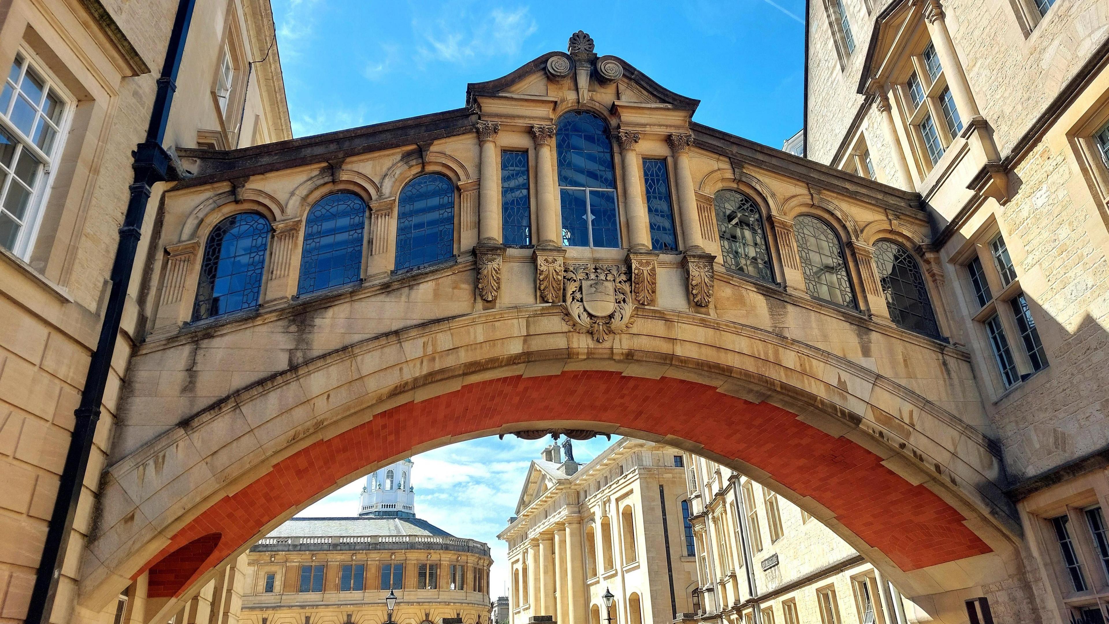 Oxford's Bridge of Sighs, stretching between two sandstone buildings in the sunshine