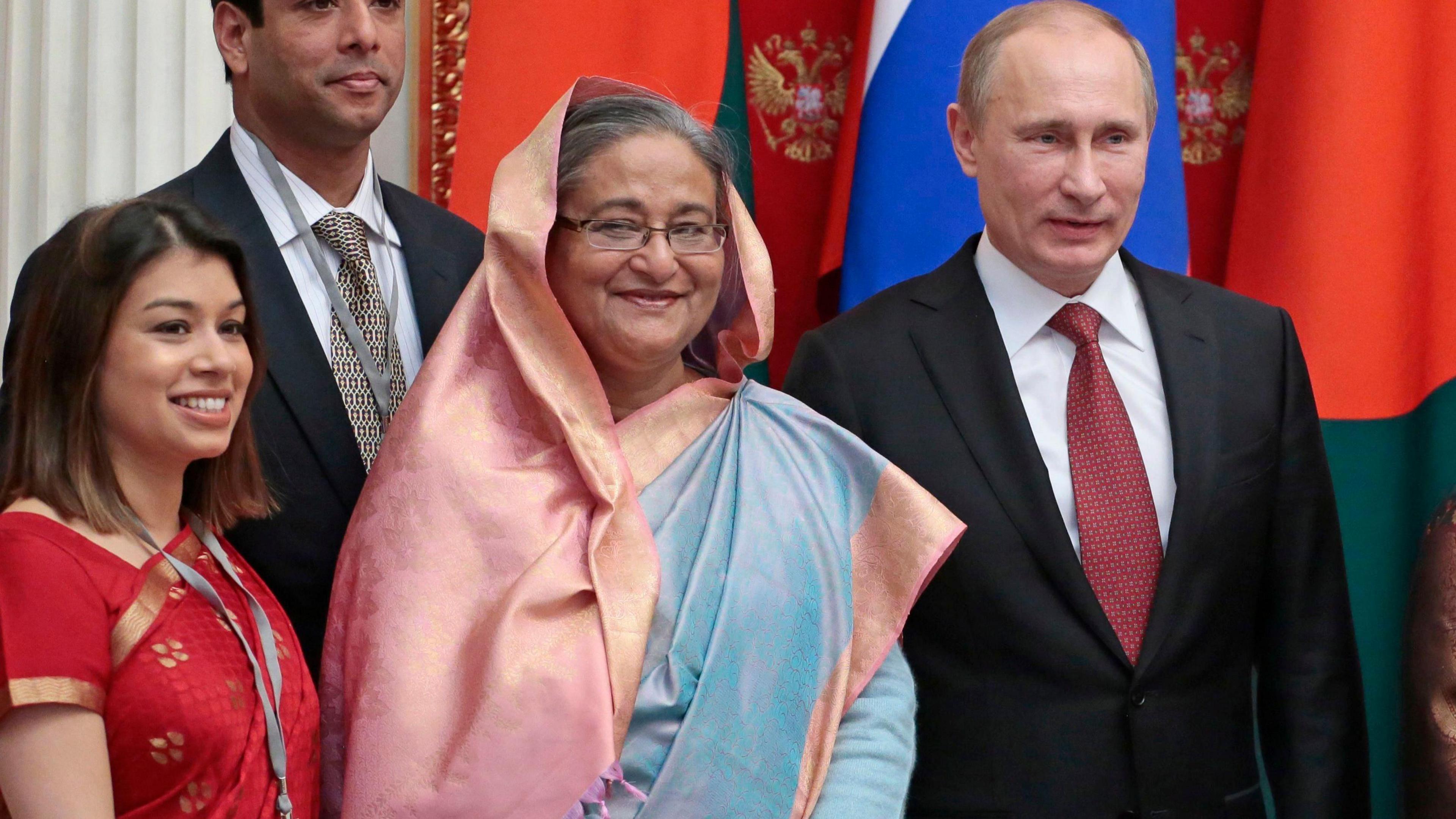 President Putin with Tulip Siddiq and Bangladesh PM Sheikh Hasina pose for photos infront of Russian and Bangladeshi flags during the signing of a deal to build the Rooppur Power Plant Project in Bangladesh