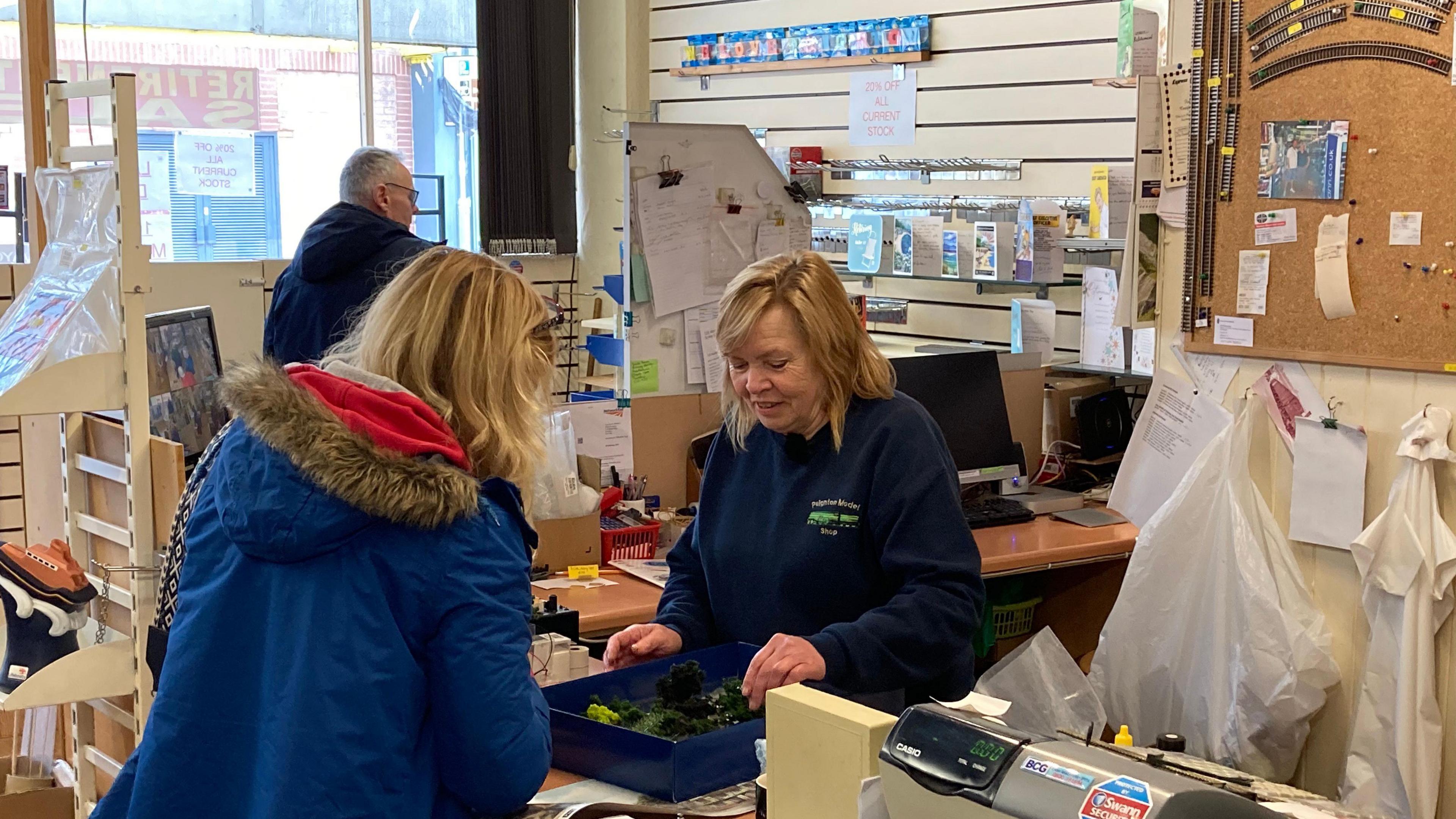 Sue Willcox serves a customer in the Paignton Model Shop