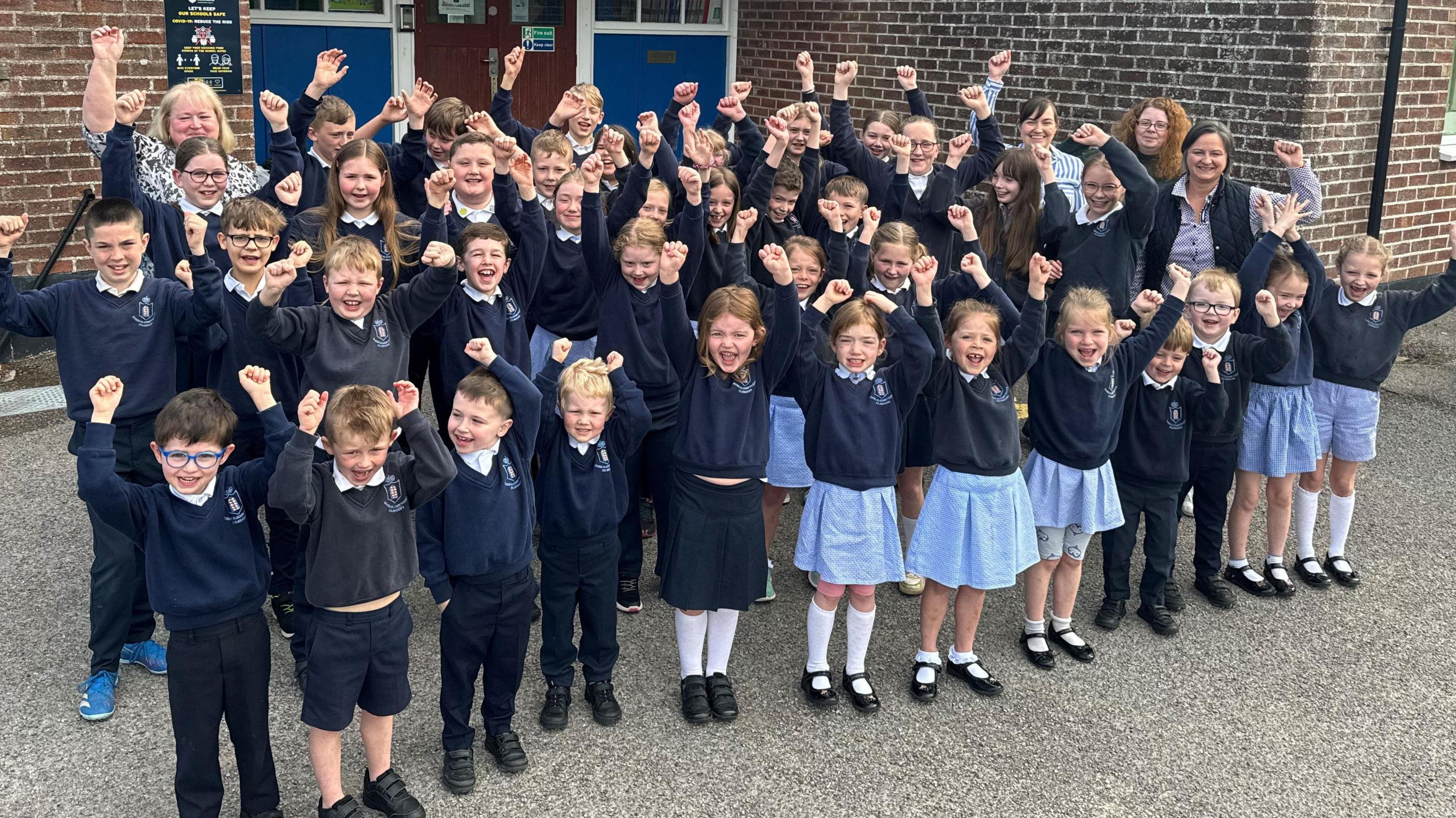 Pupils outside school building