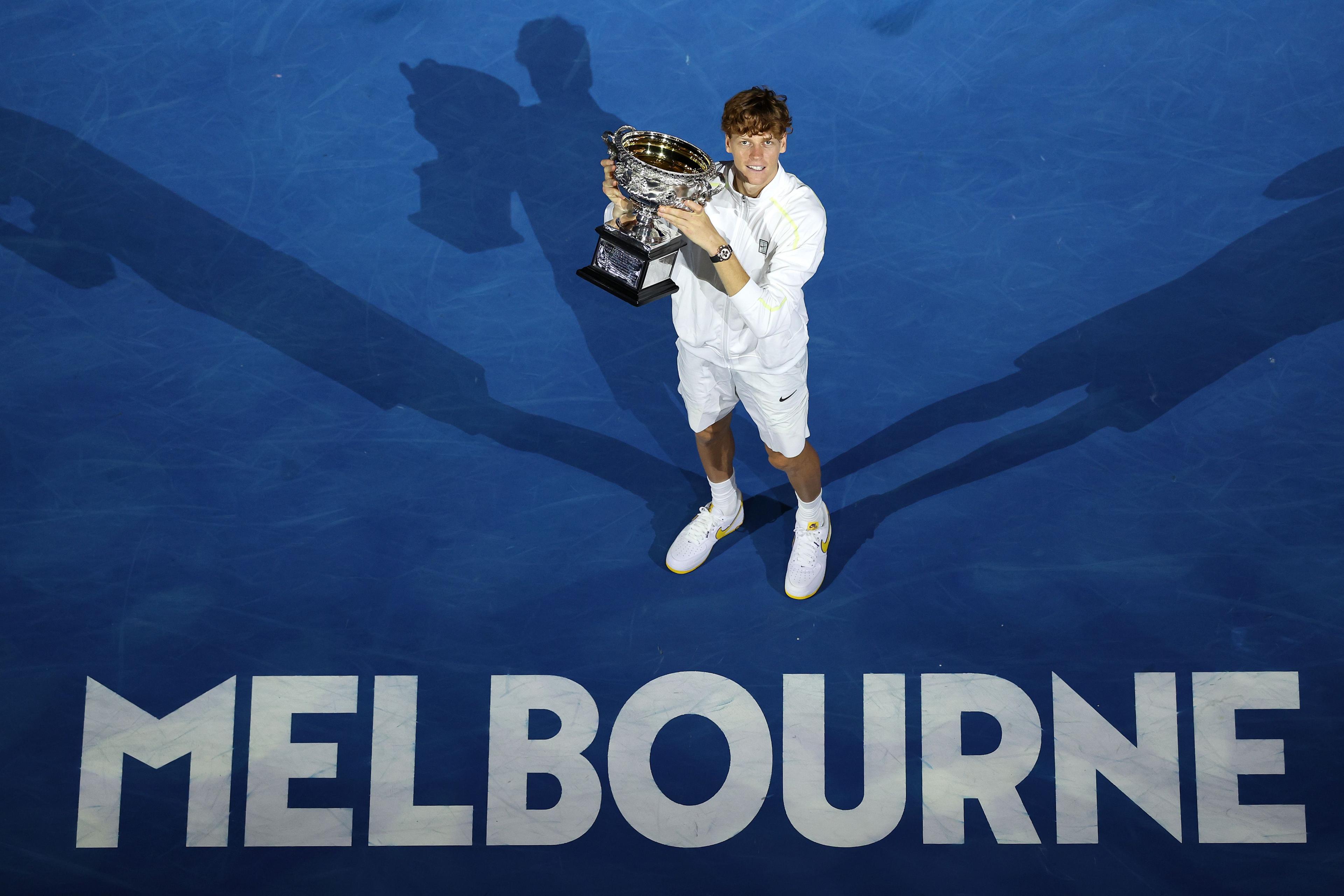 Jannik Sinner of Italy poses with the Norman Brookes Challenge Cup at the Men's Singles trophy presentation following the Men's Singles final against Alexander Zverev of Germany during day 15 of the 2025 Australian Open at Melbourne Park 