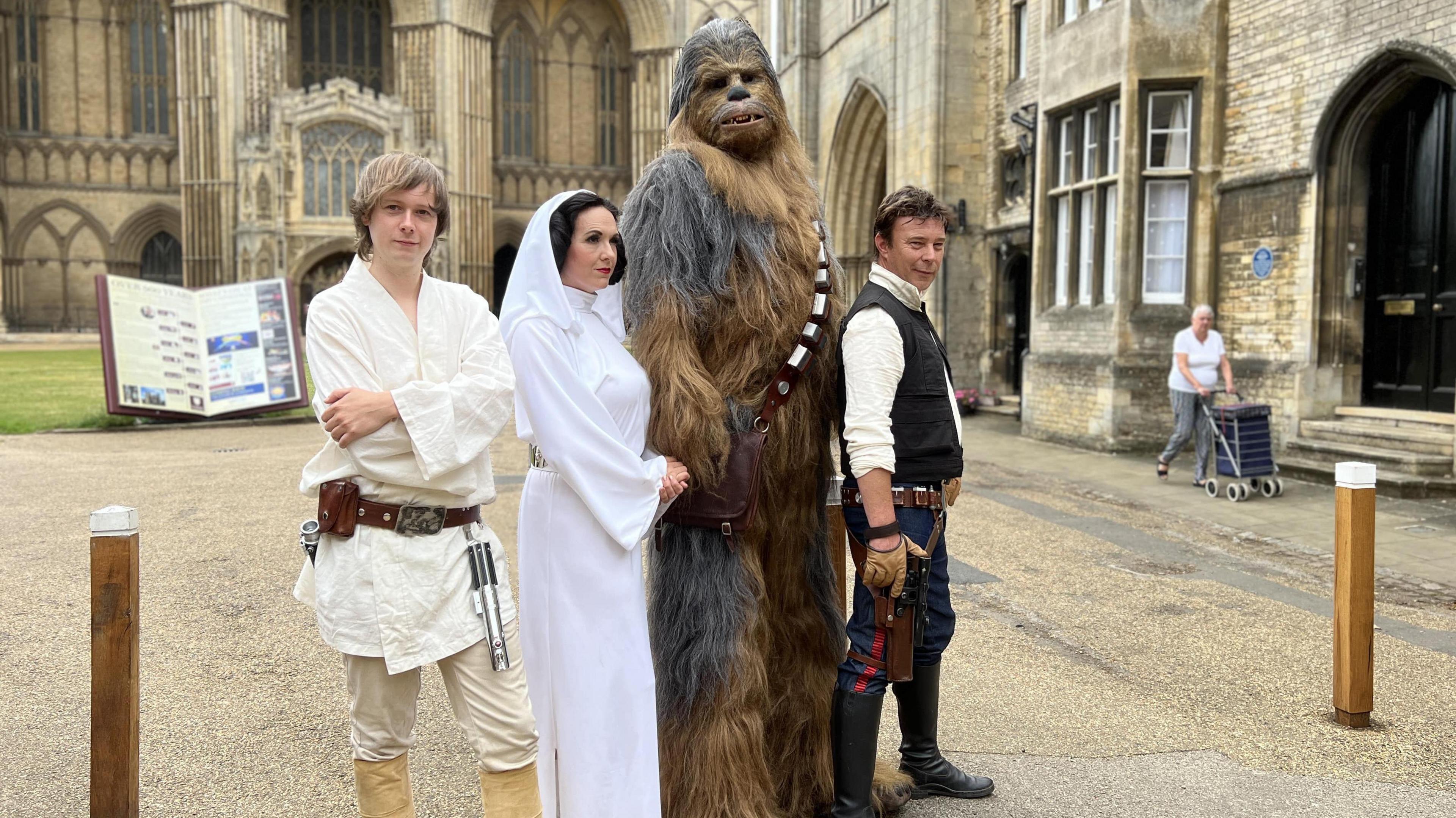 Star Wars characters Luke Skywalker, Princess Leia, Chewbacca and Han Solo pose outside Peterborough Catedral