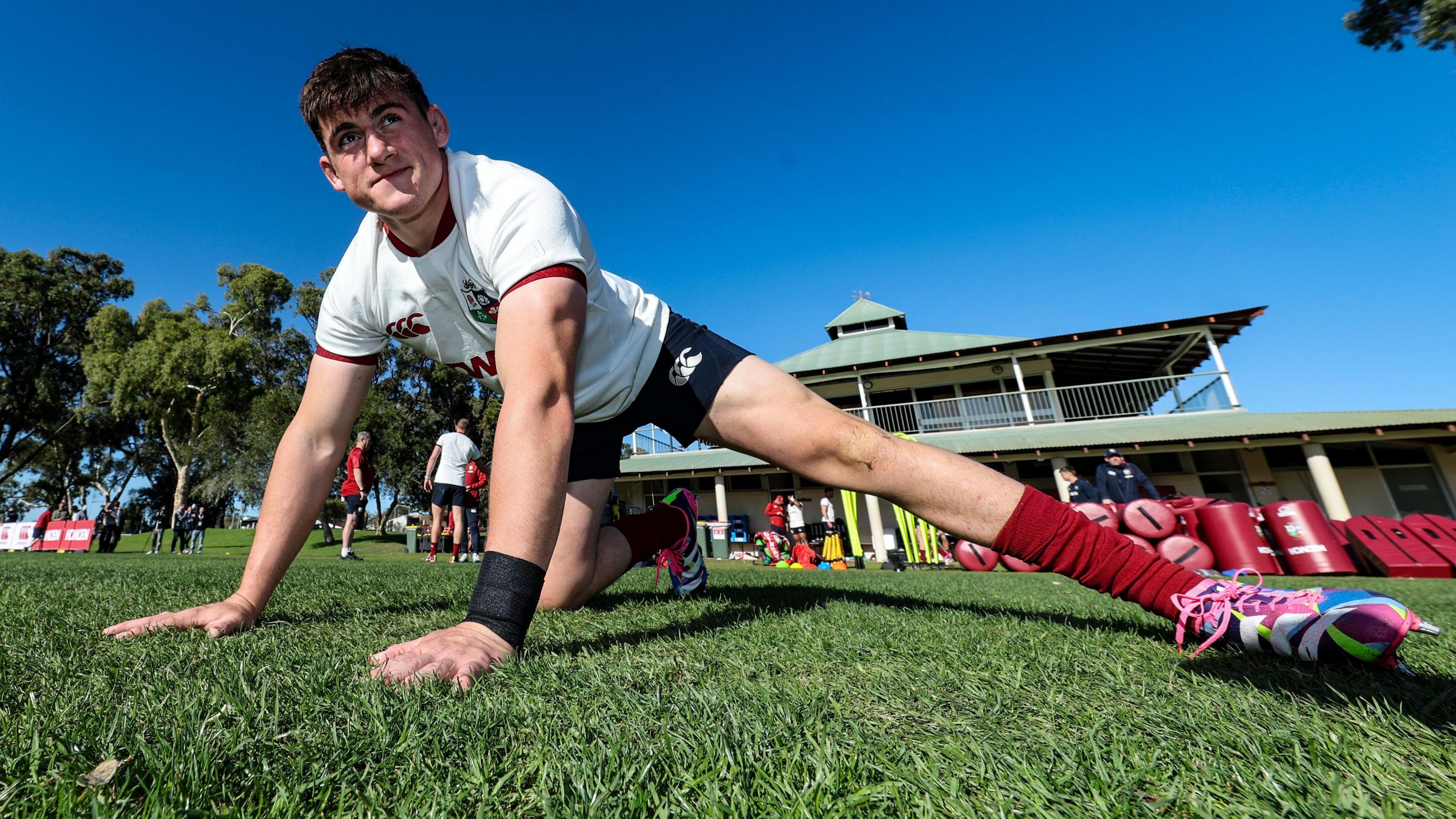 Dan Sheehan stretches while on Lions duty