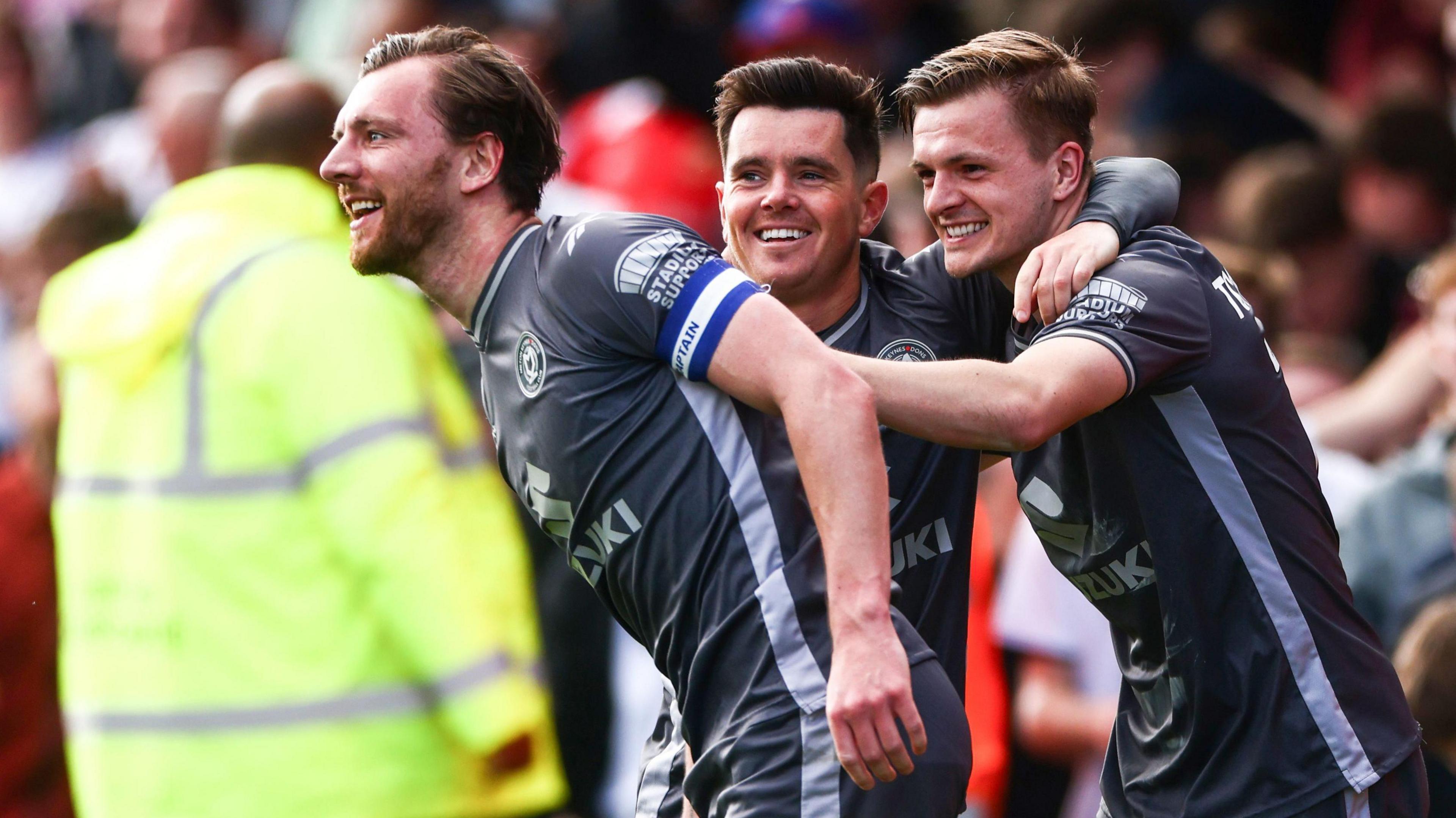 MK Dons celebrate a goal against Crew Alexandra