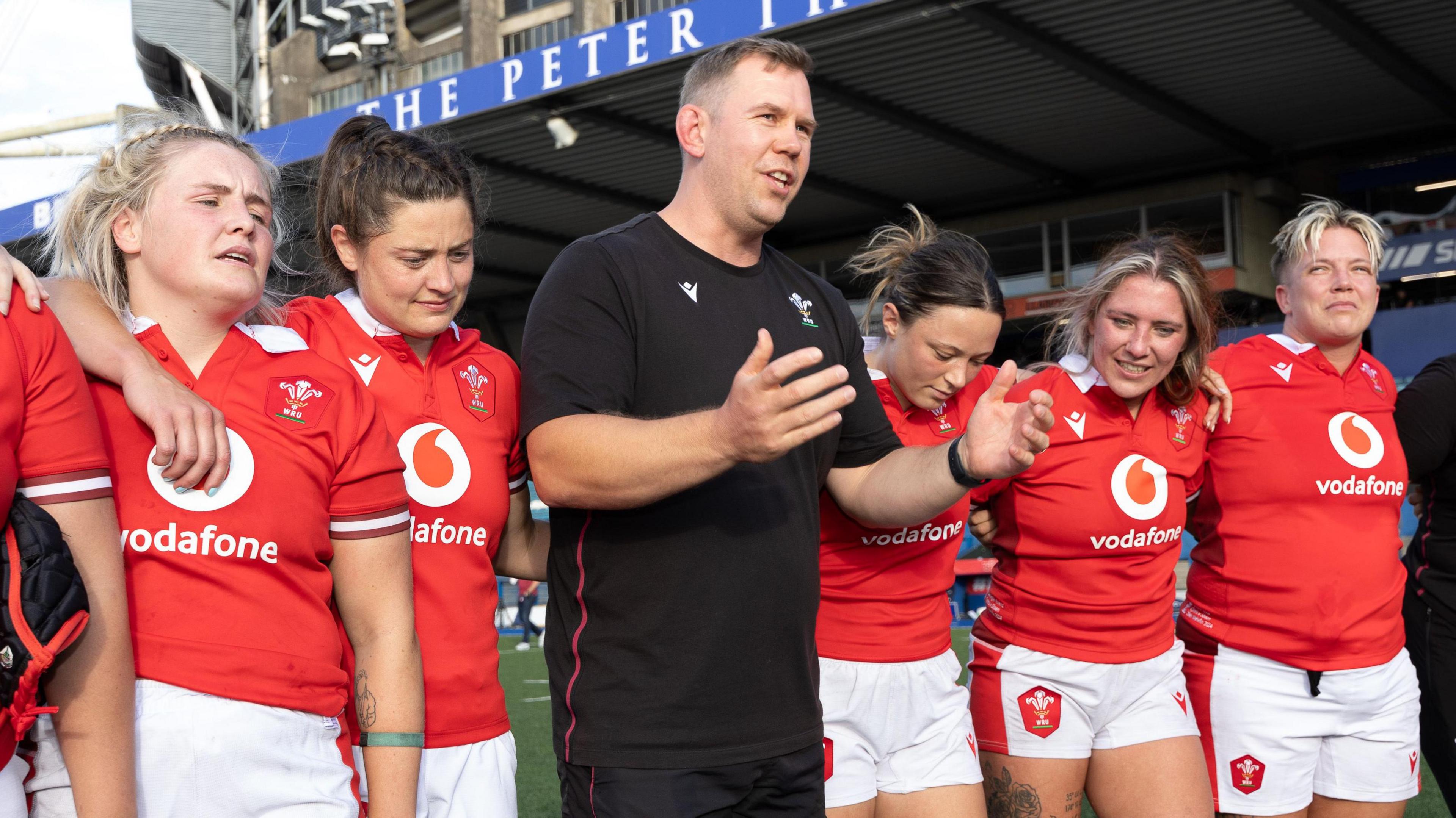 Wales head coach Ioan Cunningham speaks to his players