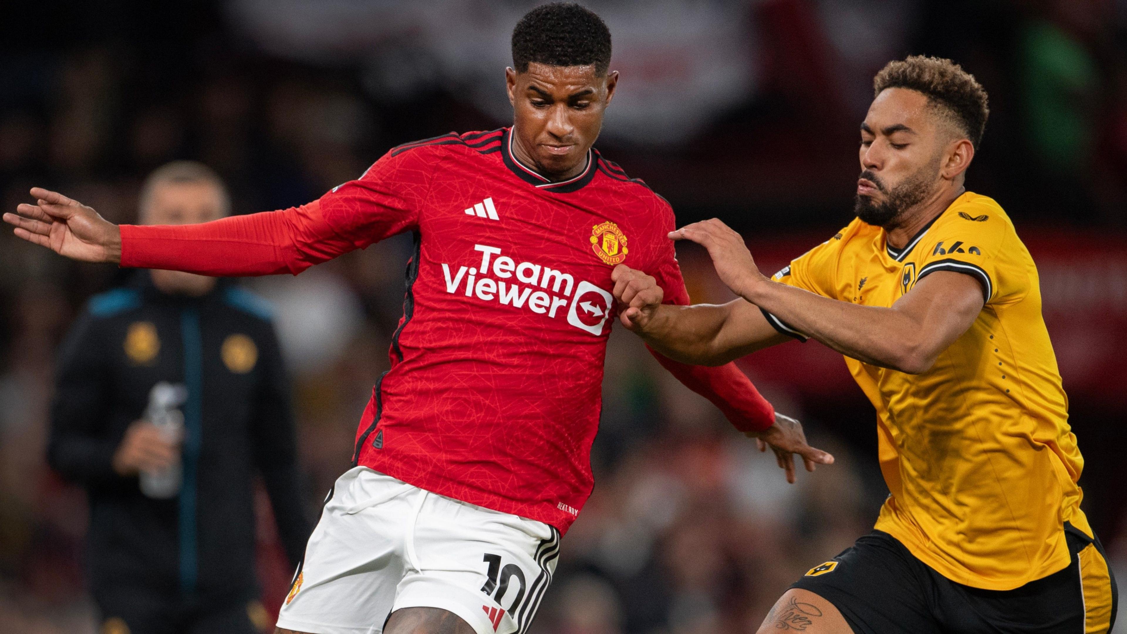 Marcus Rashford of Manchester United and Matheus Cunha of Wolverhampton Wanderers in action