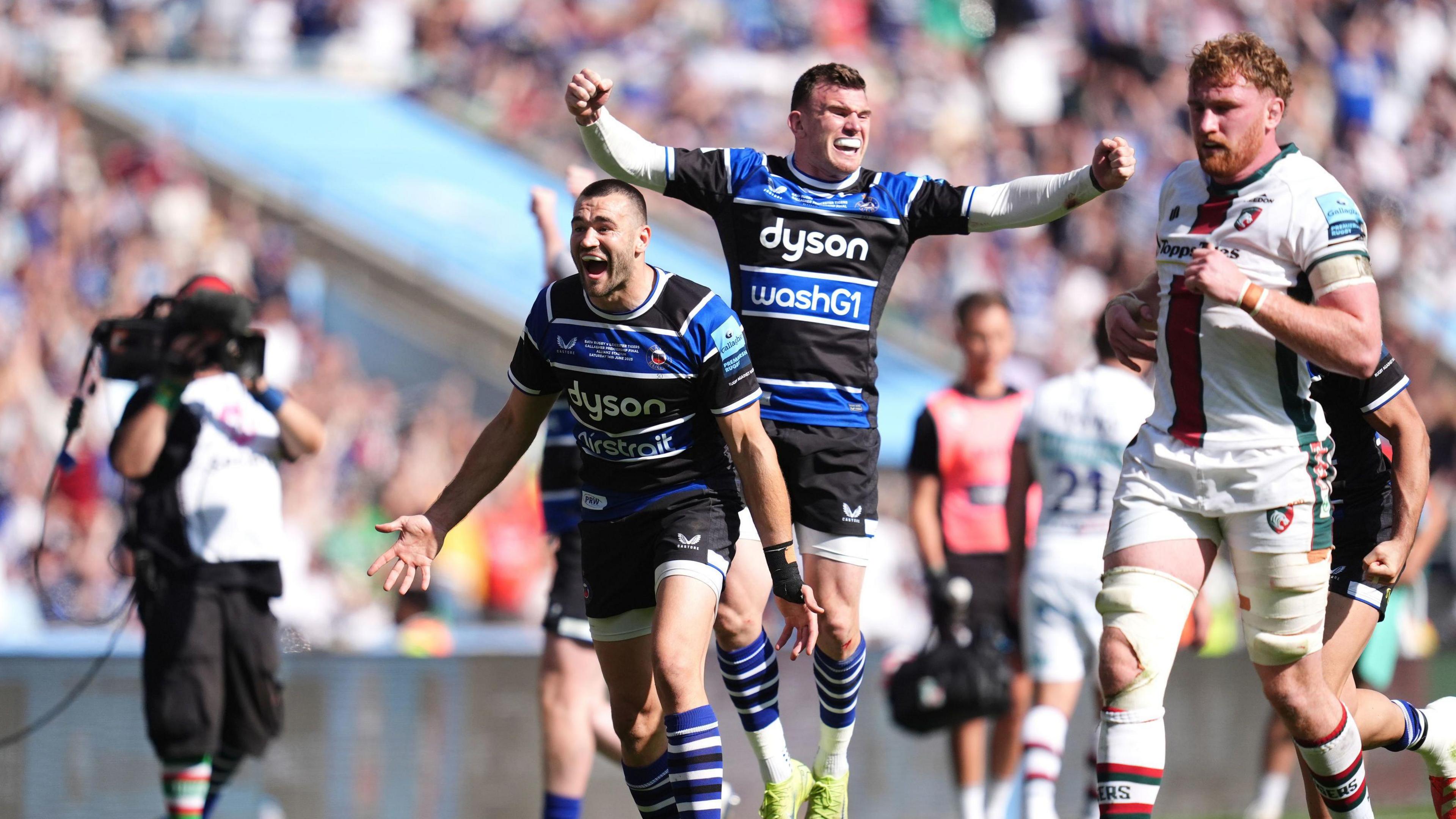 Will Muir and Ben Spencer jump in celebration at the final whistle