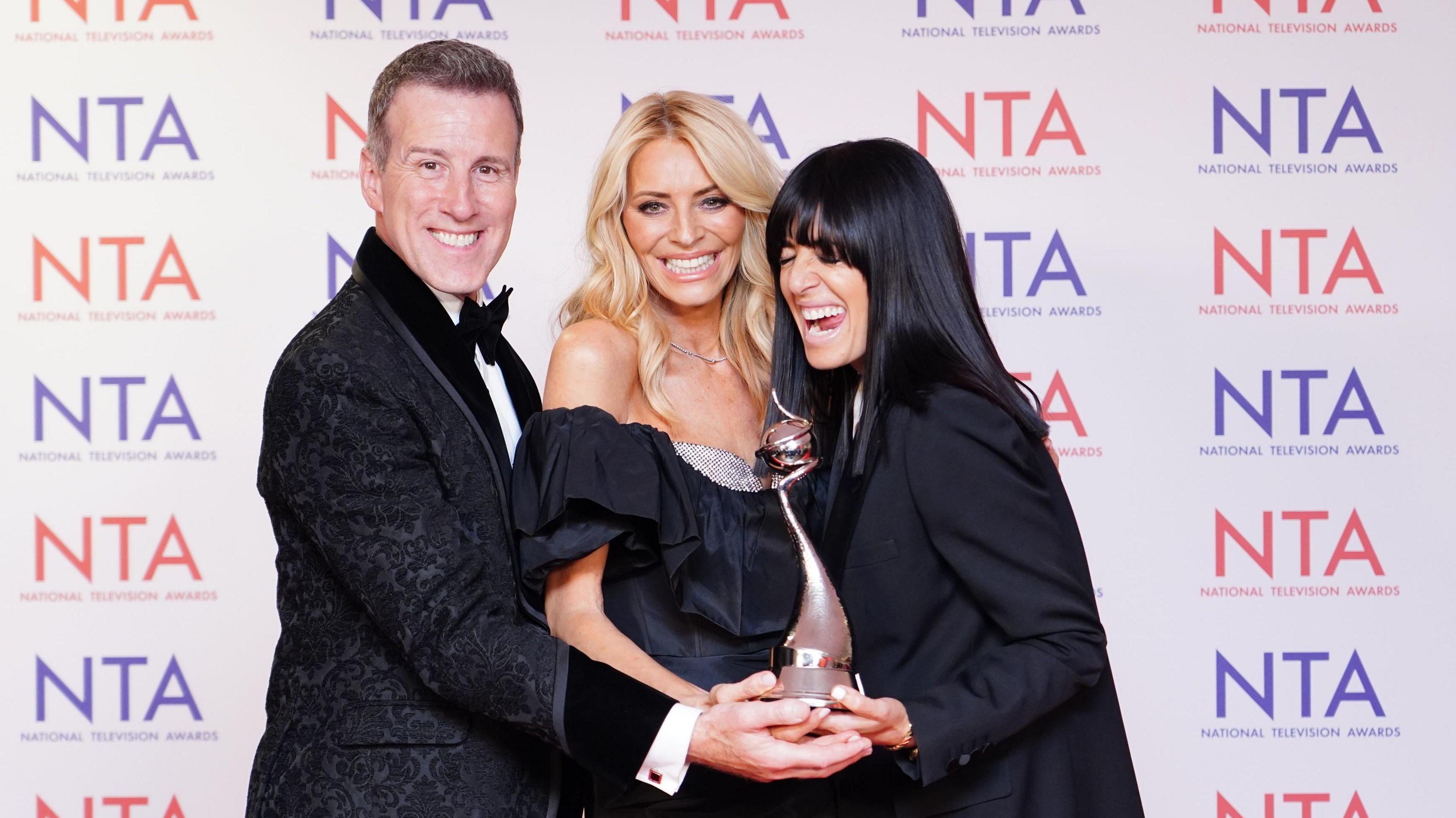 Judge Anton du Beke and presenters Tess Daly and Claudia Winkleman pose together after winning their NTA trophy