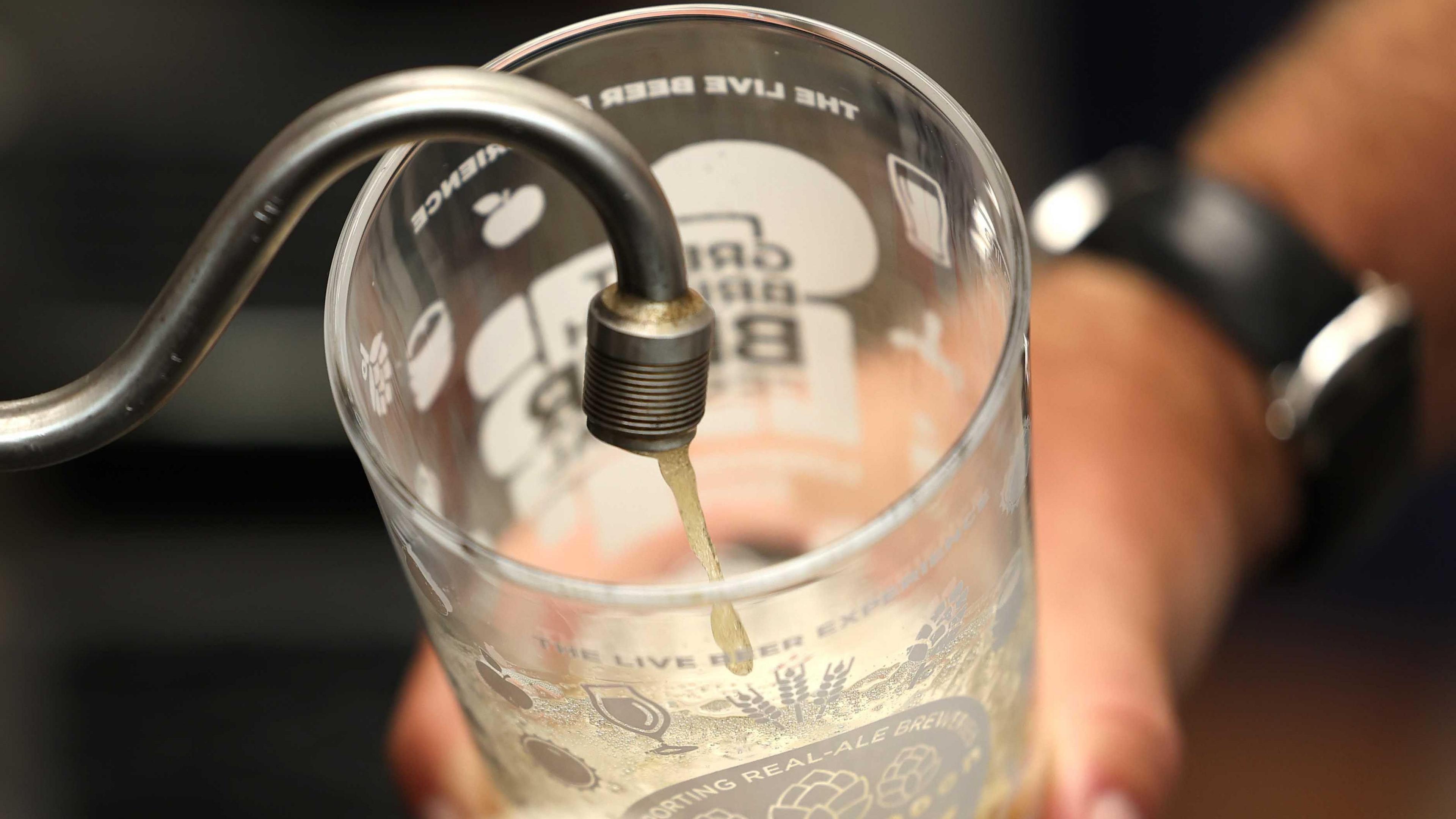 A generic photo of beer being poured into a pint glass at a pub.