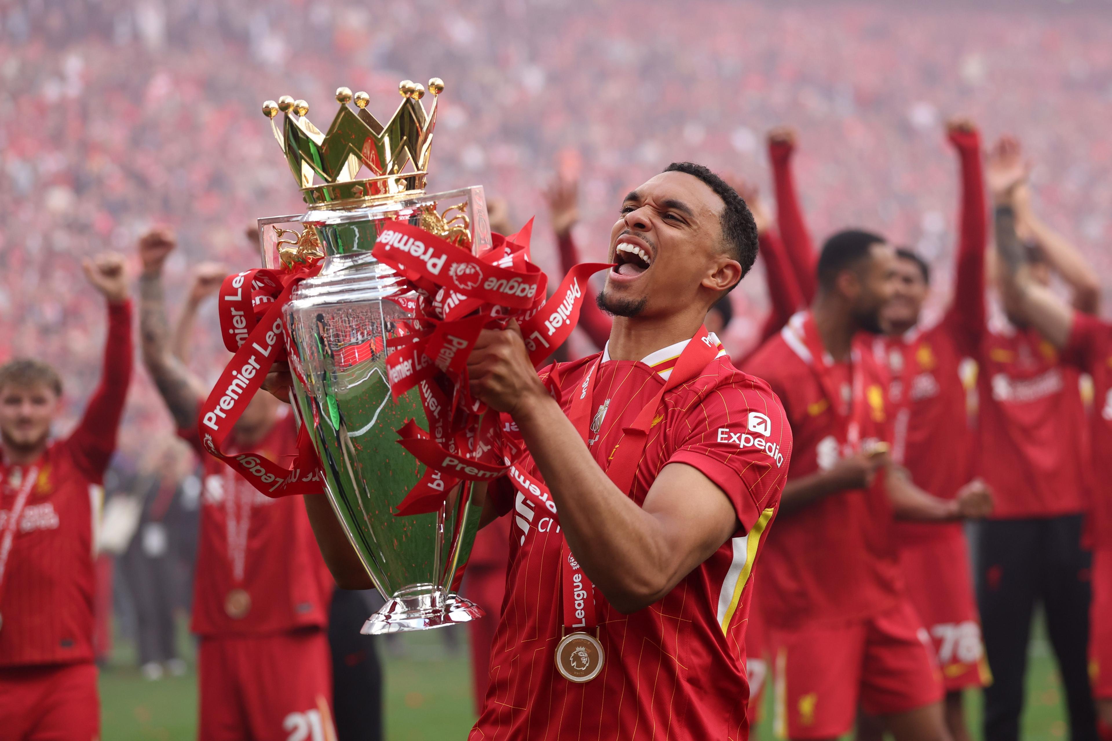 Liverpool's Trent Alexander-Arnold celebrates with Premier League trophy after his final appearance for Liverpool. Photo by Carl Recine