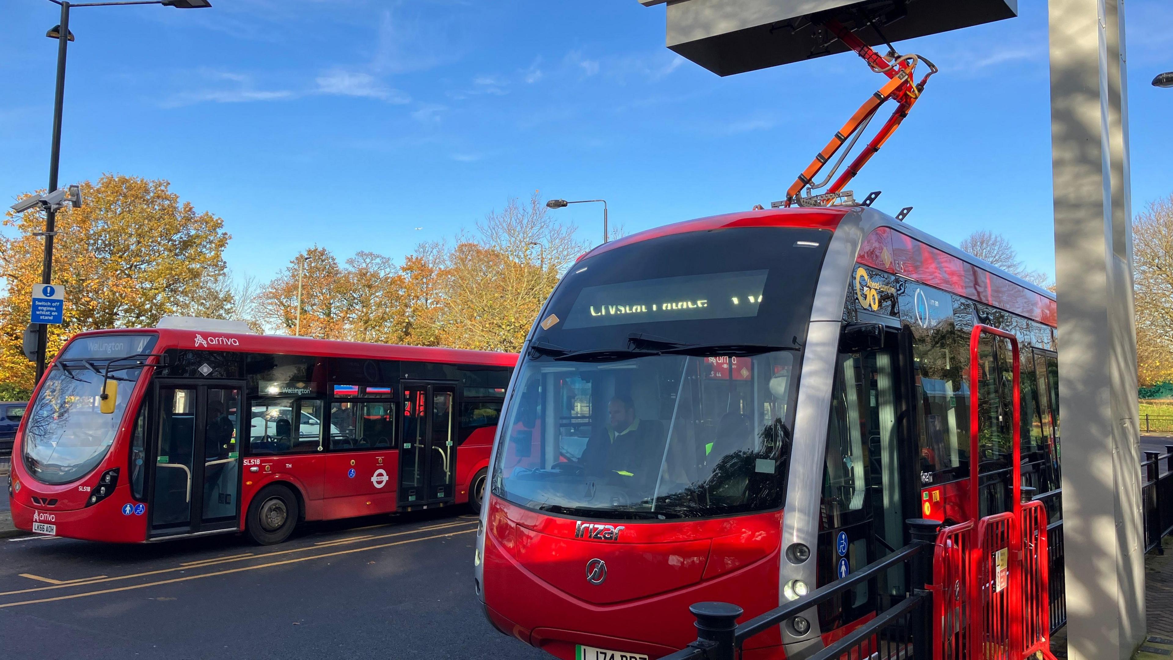 The new electric 358 bus at a charging point .