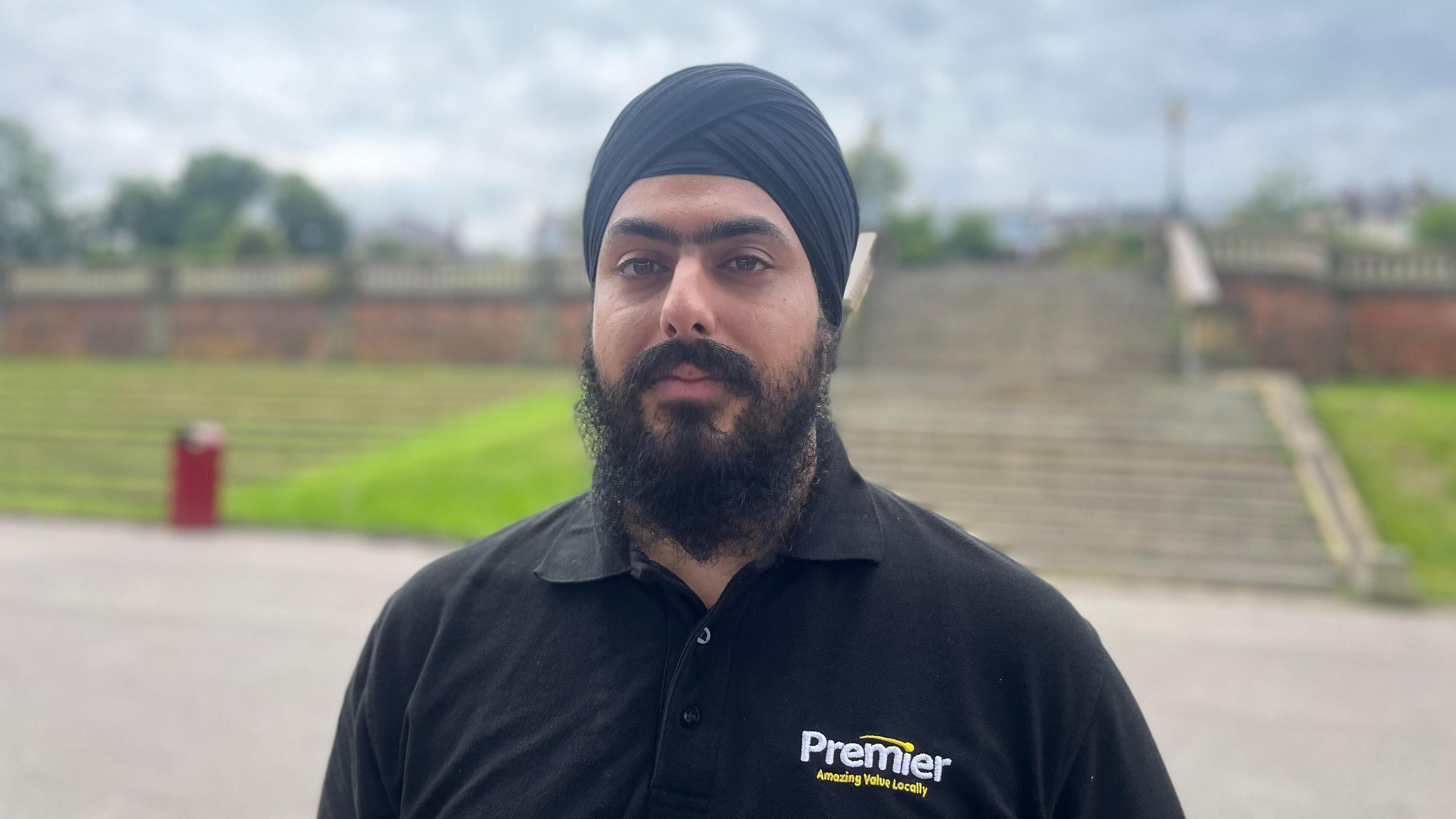 Jag Singh wearing a turban and a black t-shirt.