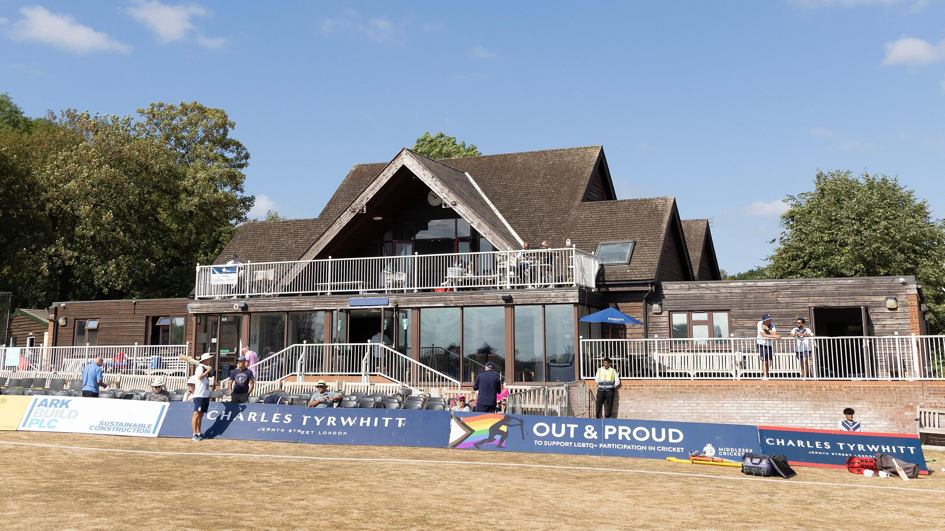 Shot of the pavilion at Middlesex CCC's Radlett ground, with parched grass in foreground