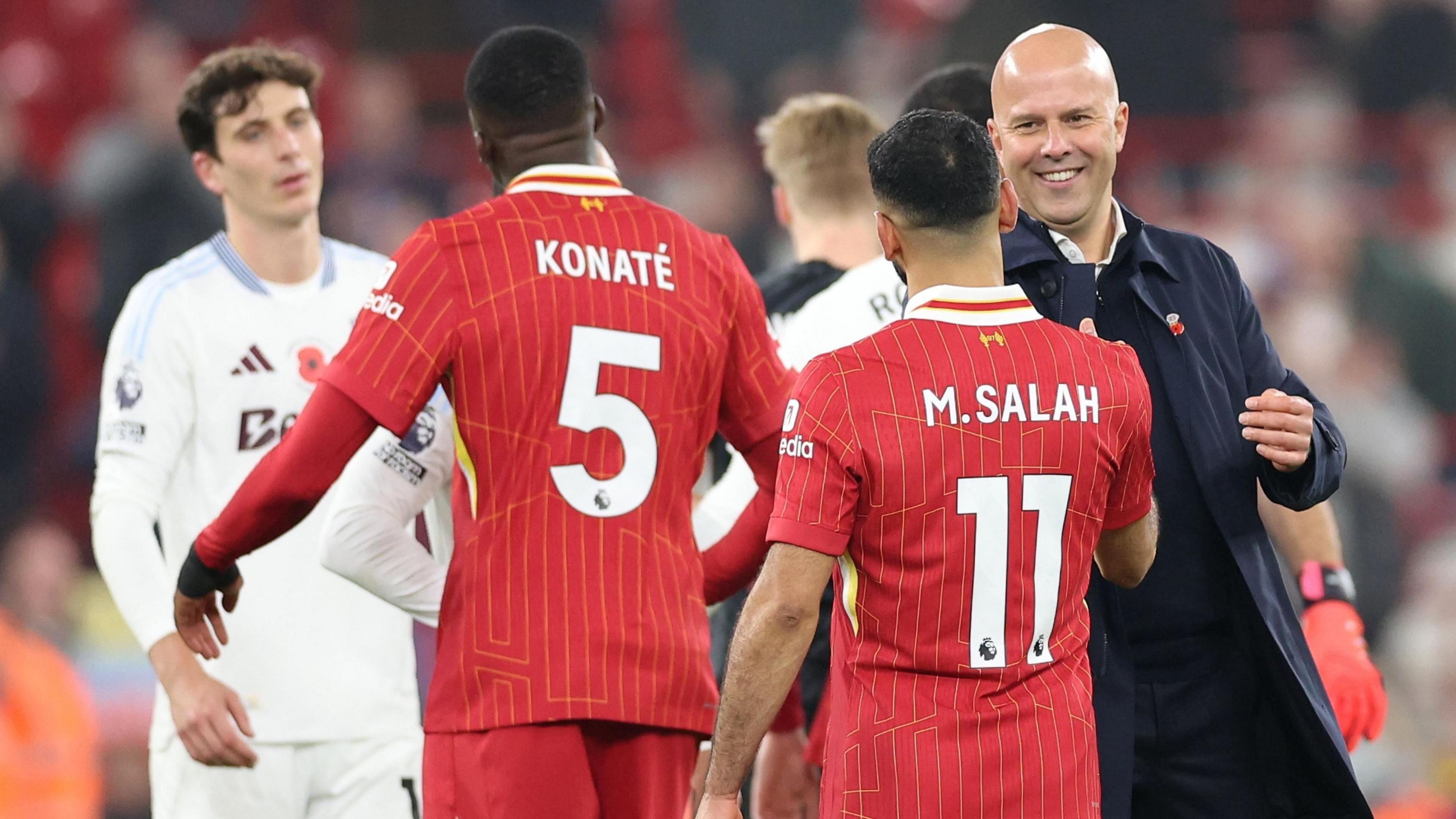 Liverpool manager Arne Slot shakes the hand of his Liverpool players including Mo Salah