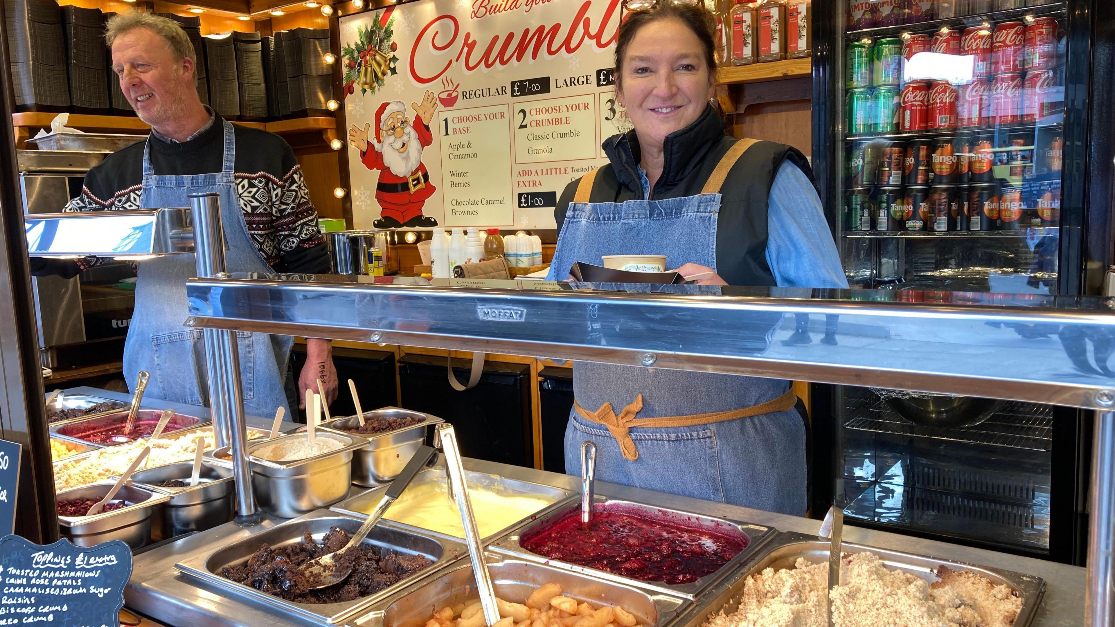 Rebecca Storey behind the counter at her crumble stall