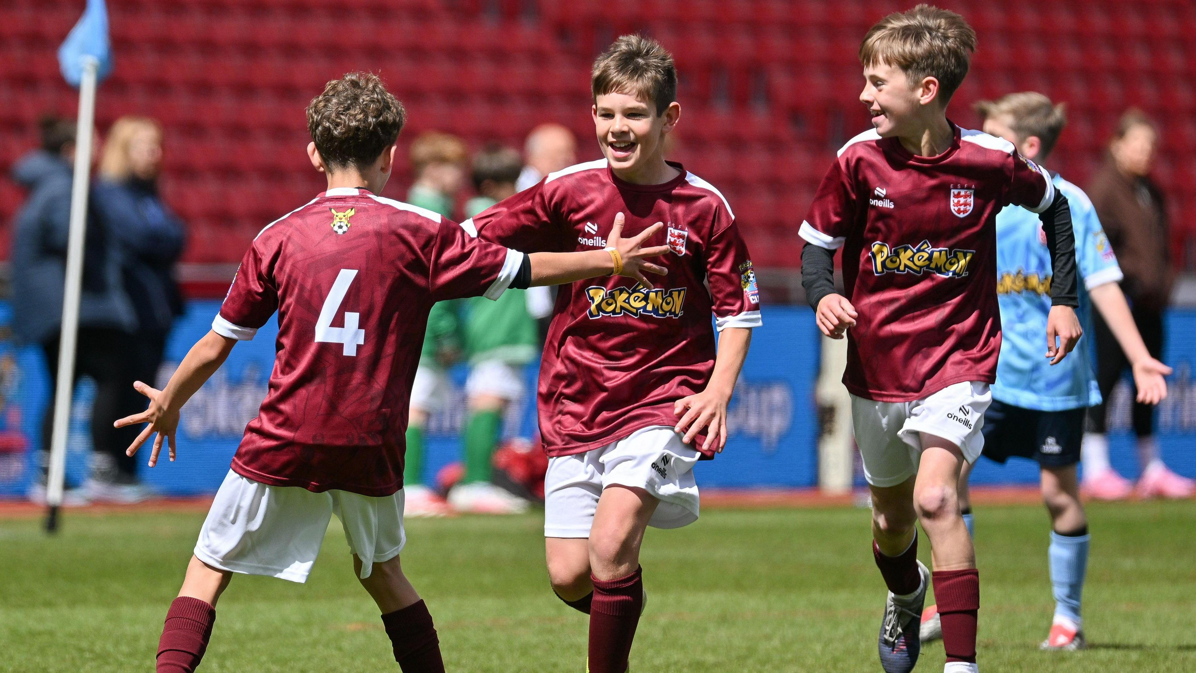 Three children seen on the pitch during one of the matches