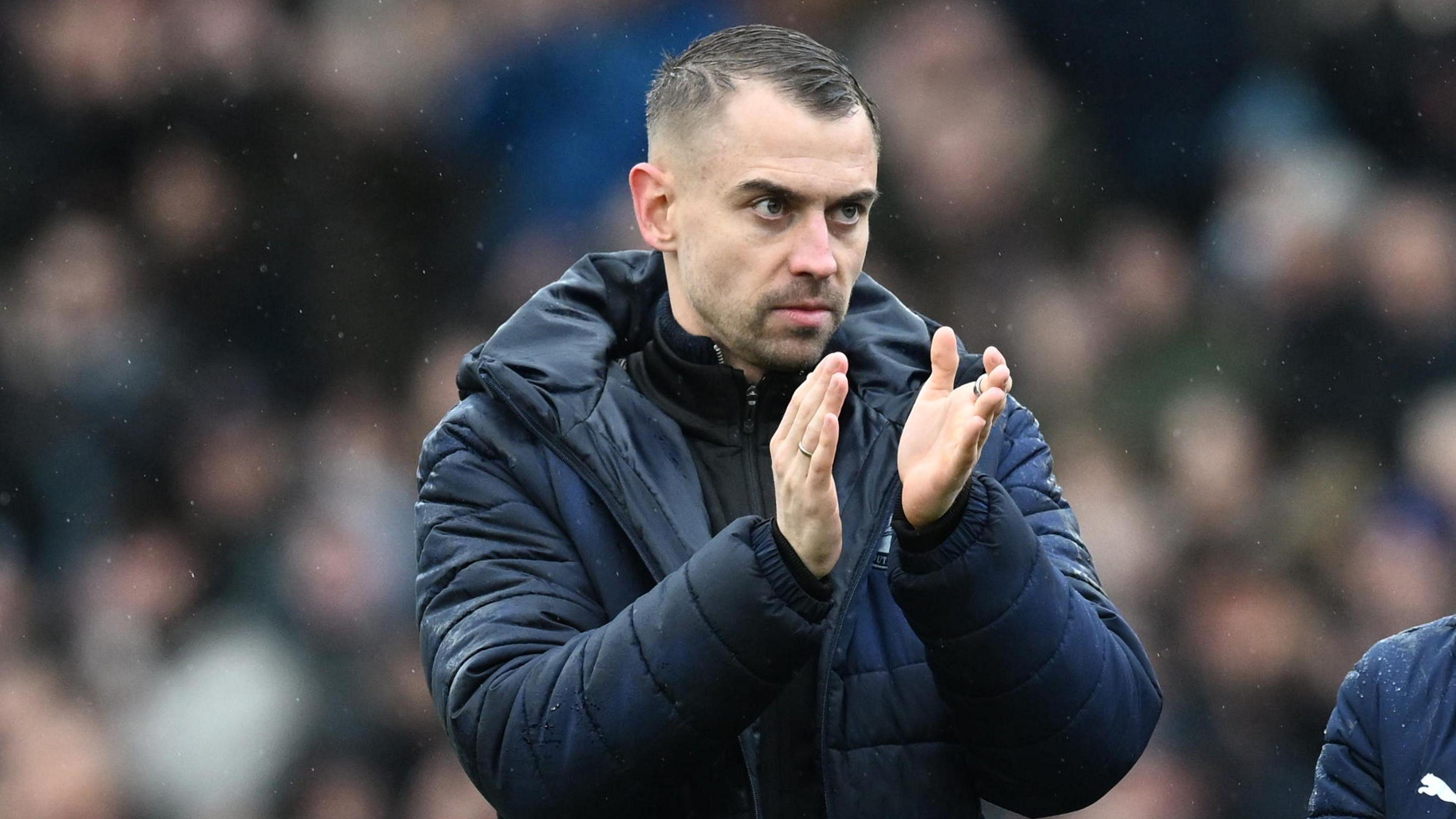 Tonda Eckert applauds the fans after a draw with Portsmouth 