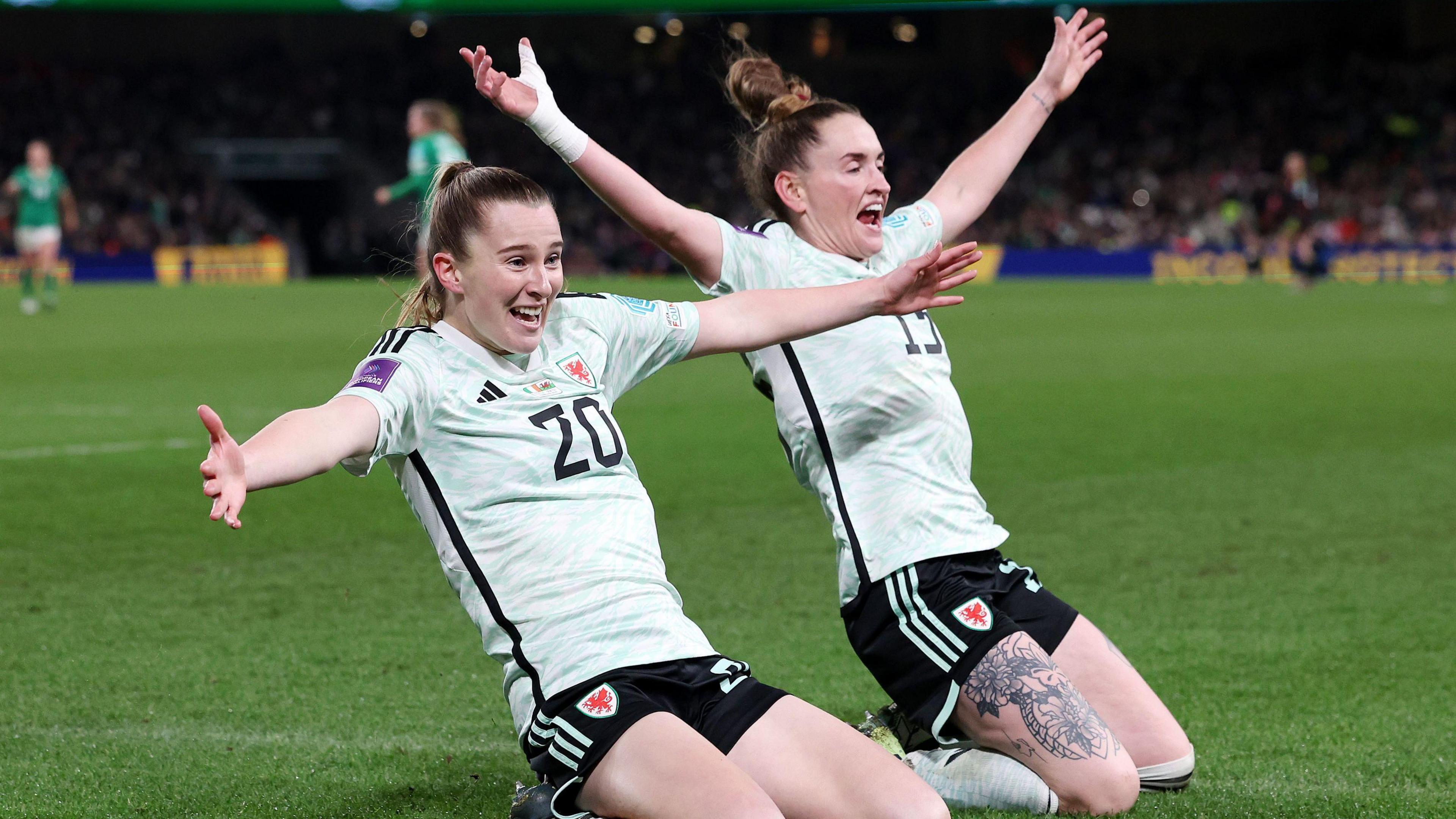 Wales' Carrie Jones (left) celebrates scoring their side's second goal with team-mate Rachel Rowe during the UEFA Women's Euro 2025 Qualifying play off round two, second leg match at the Aviva Stadium, Dublin in Ireland.