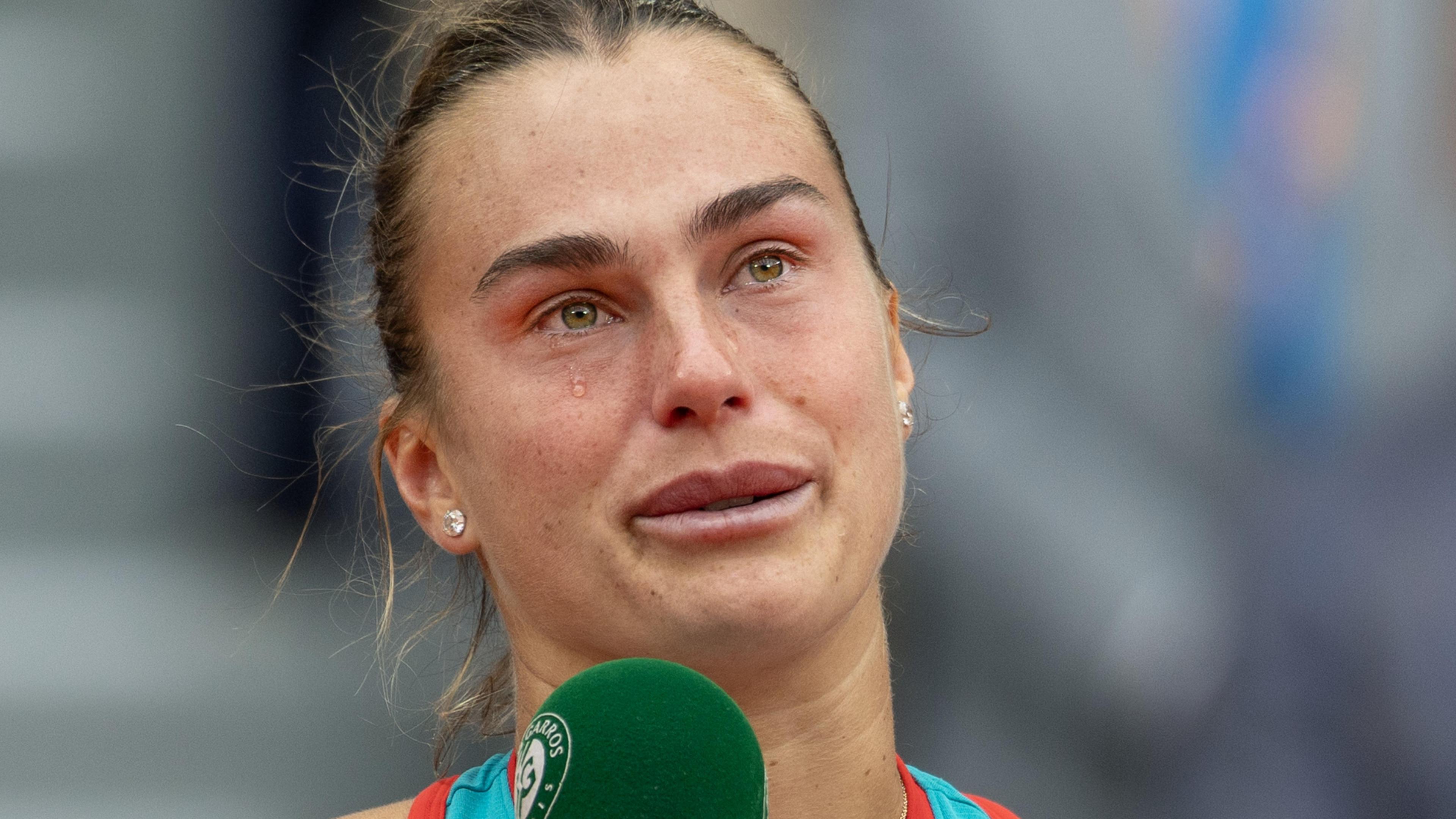 Aryna Sabalenka cries during her on-court speech after her French Open final defeat