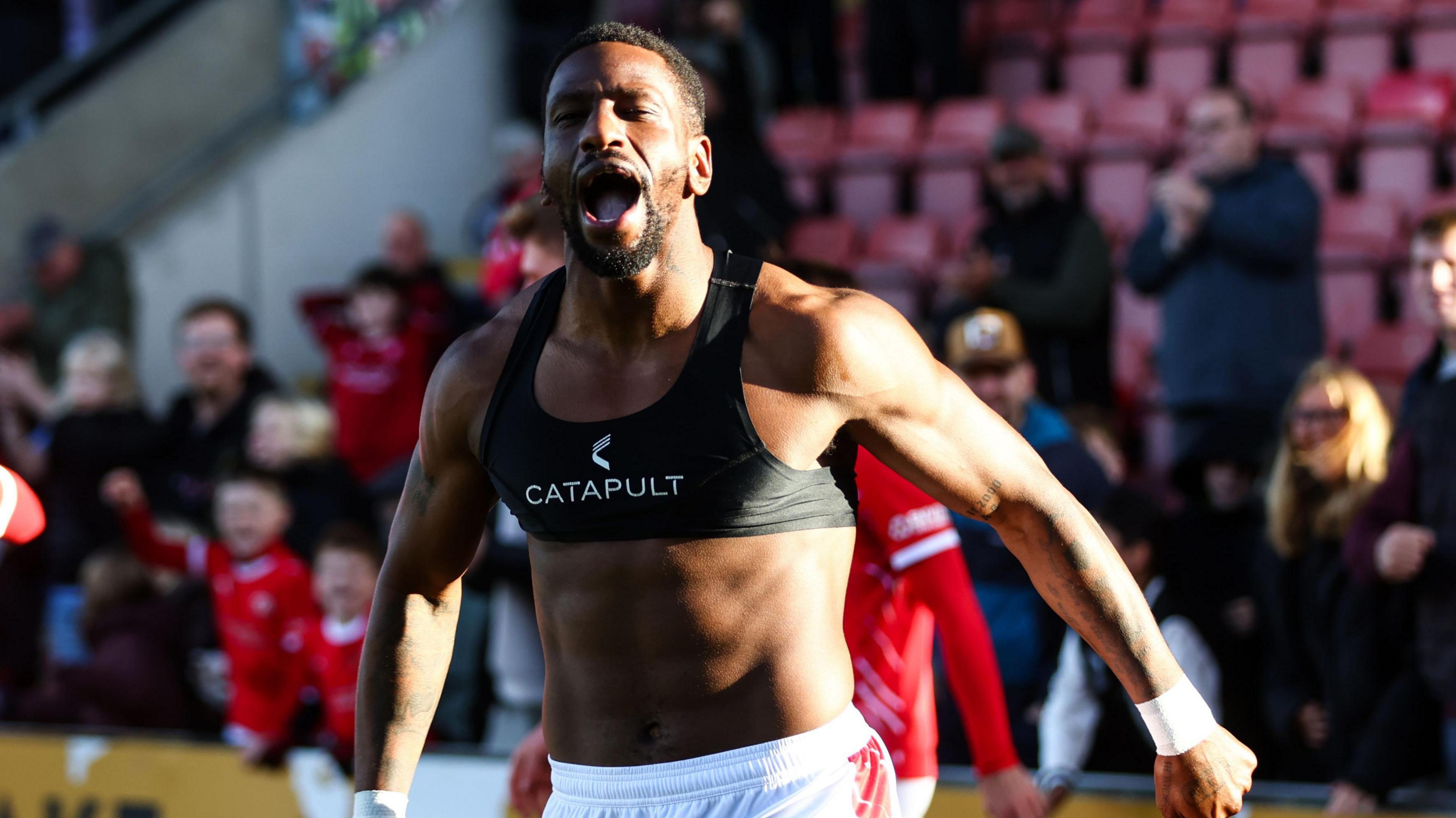 Omar Bogle of Crewe Alexandra celebrates scoring his side's third goal against Shrewsbury Town