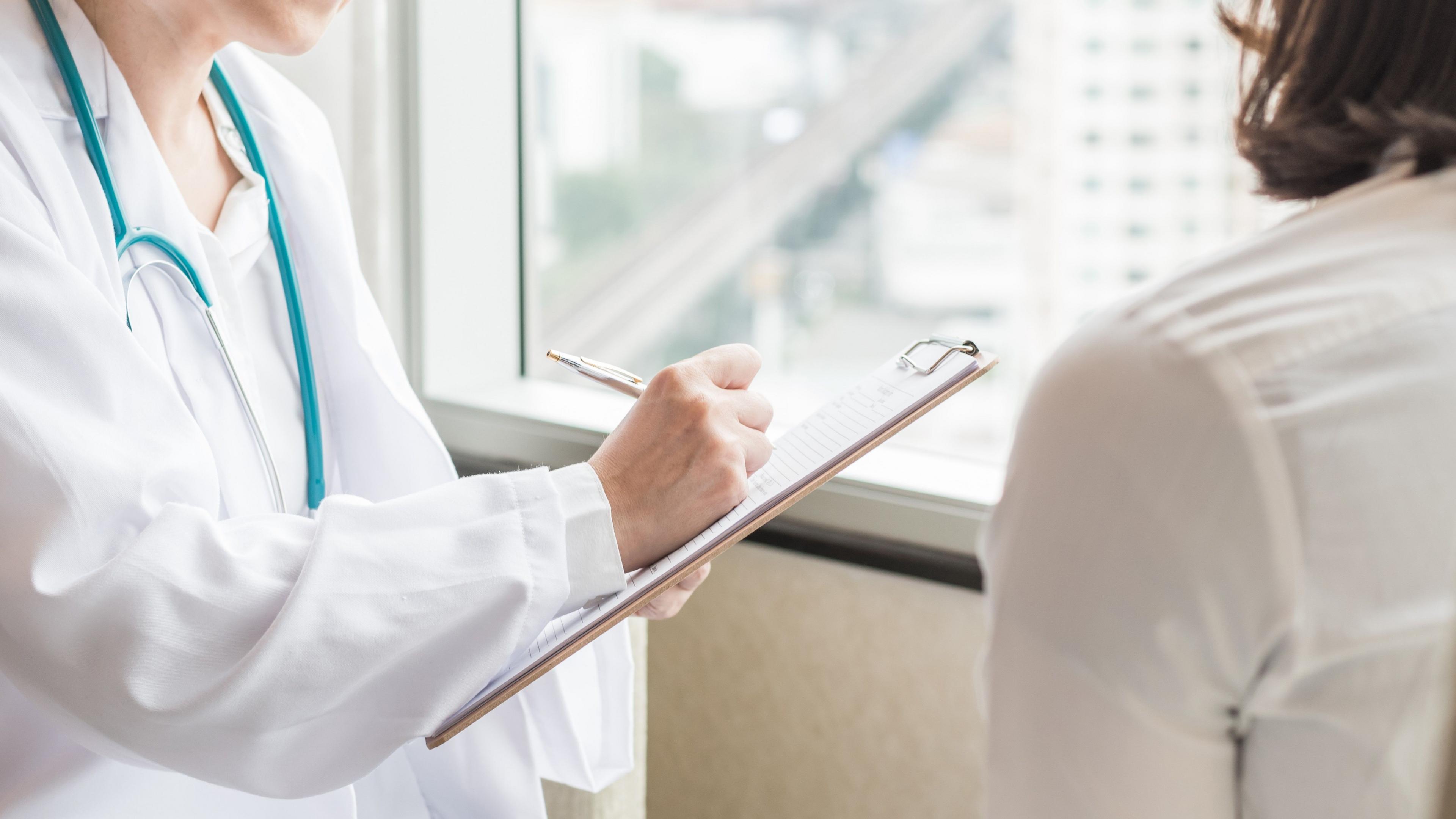 Doctor in consultation with a woman patient