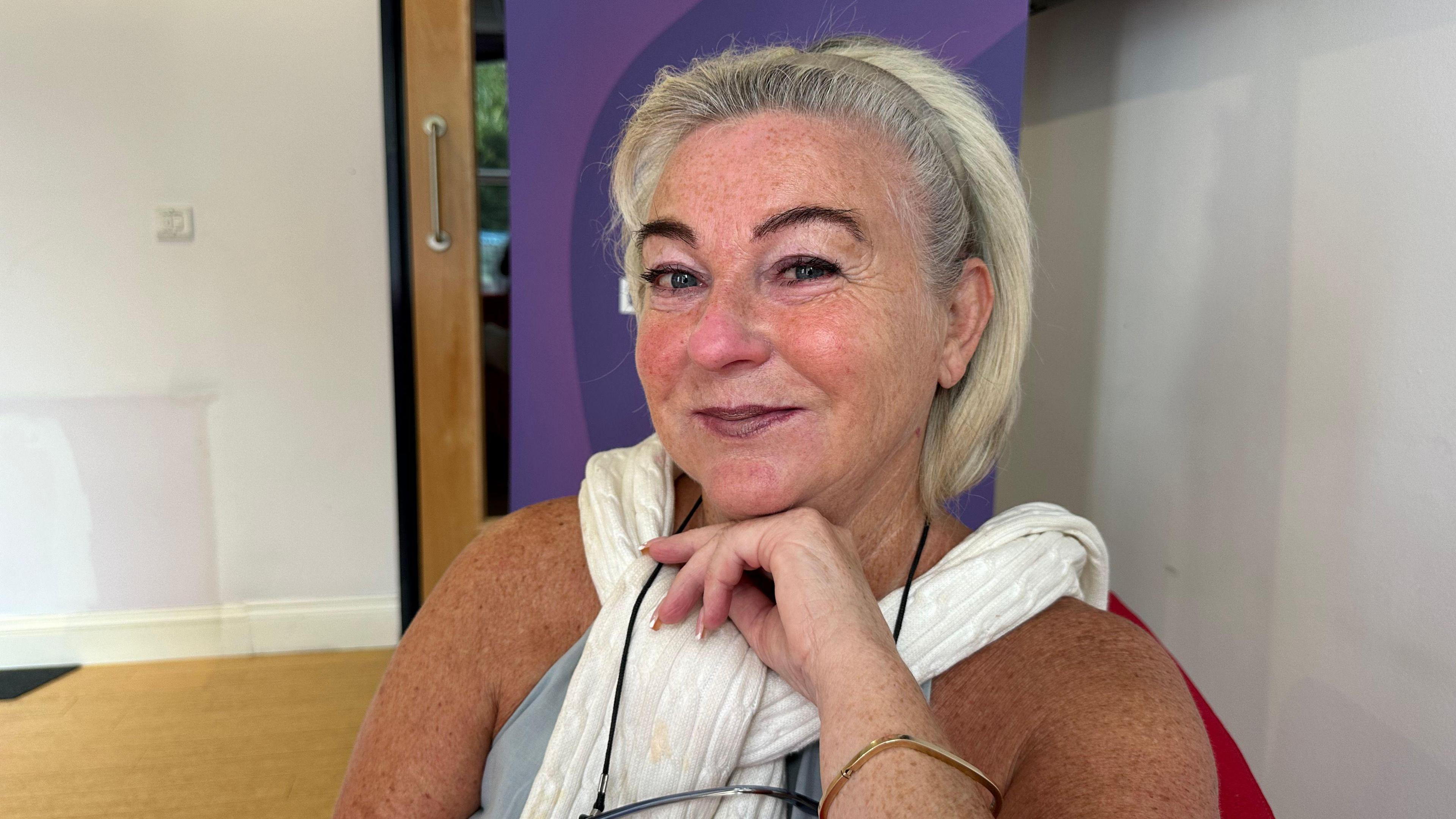 A portrait photograph of Teresa Mayo looking at the camera