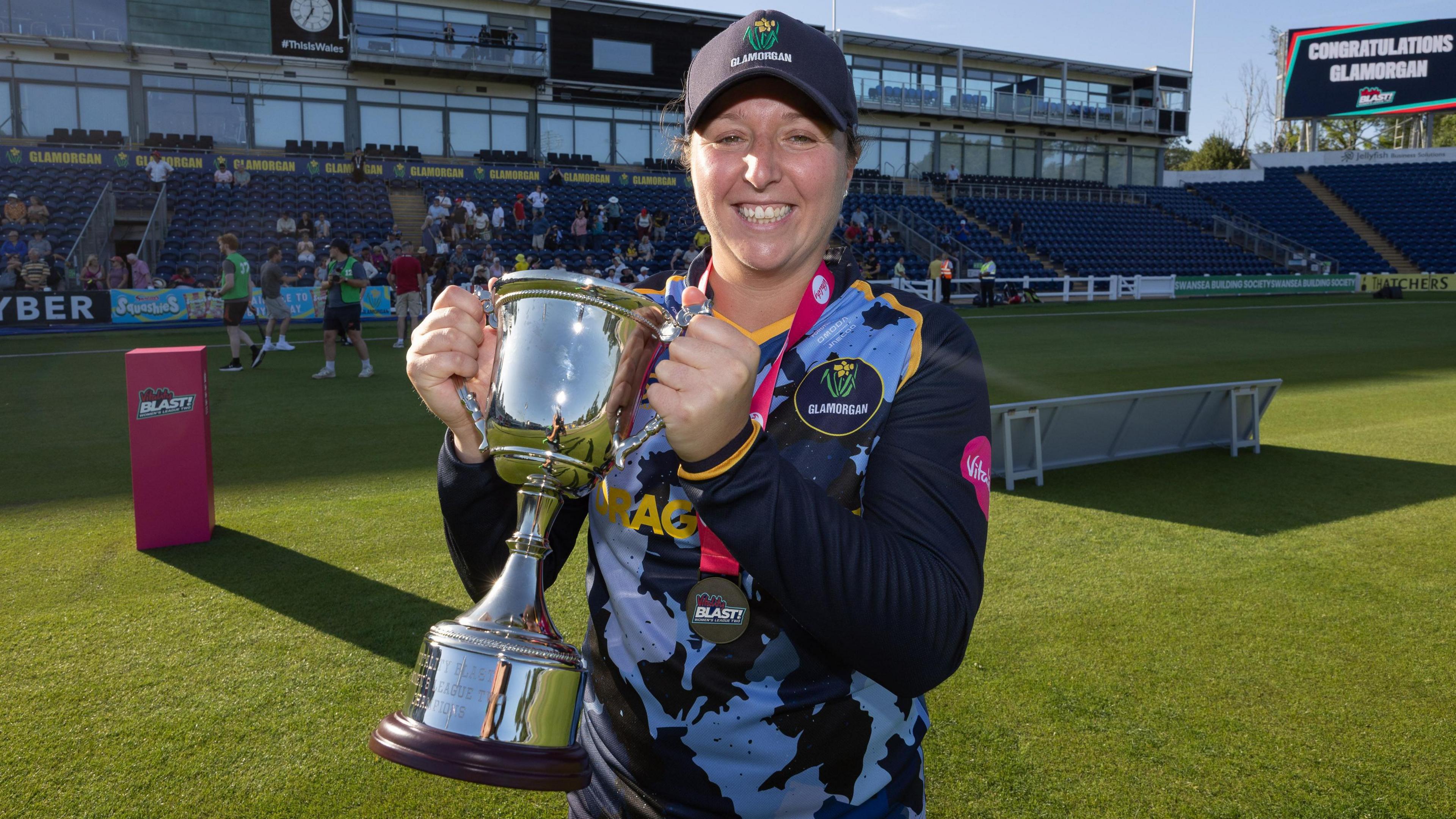 Glamorgan captain Lauren Parfitt lifting the Vitality Women's T20 Blast League 2 trophy after defeating Gloucestershire.