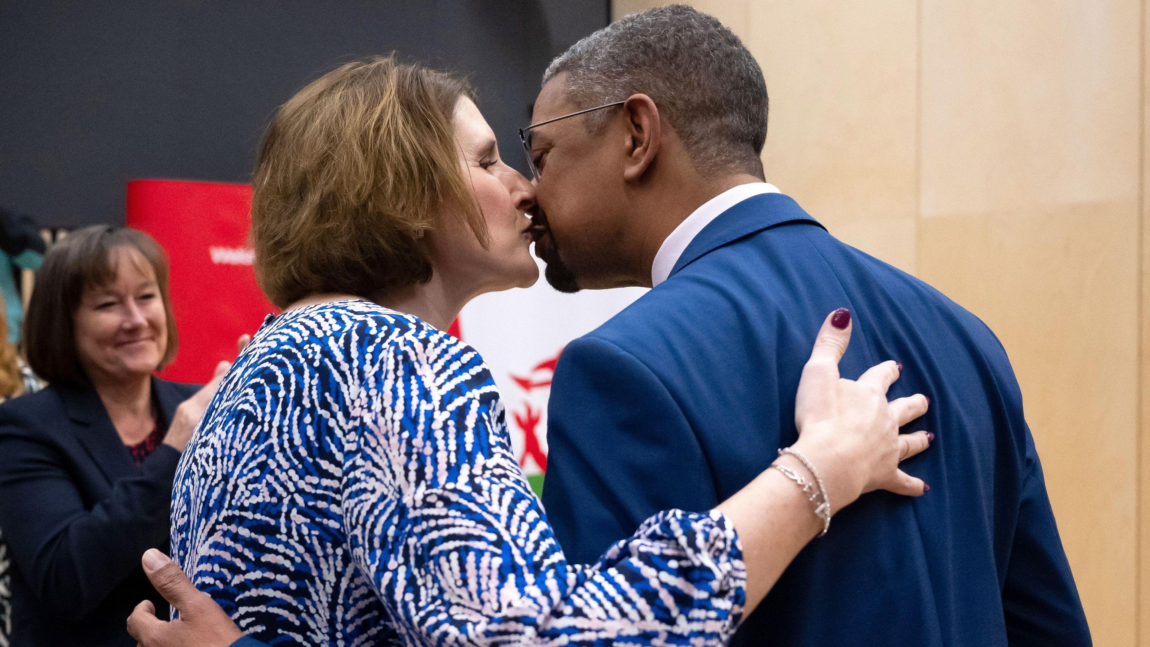 Vaughan Gething kisses his wife, Michelle.