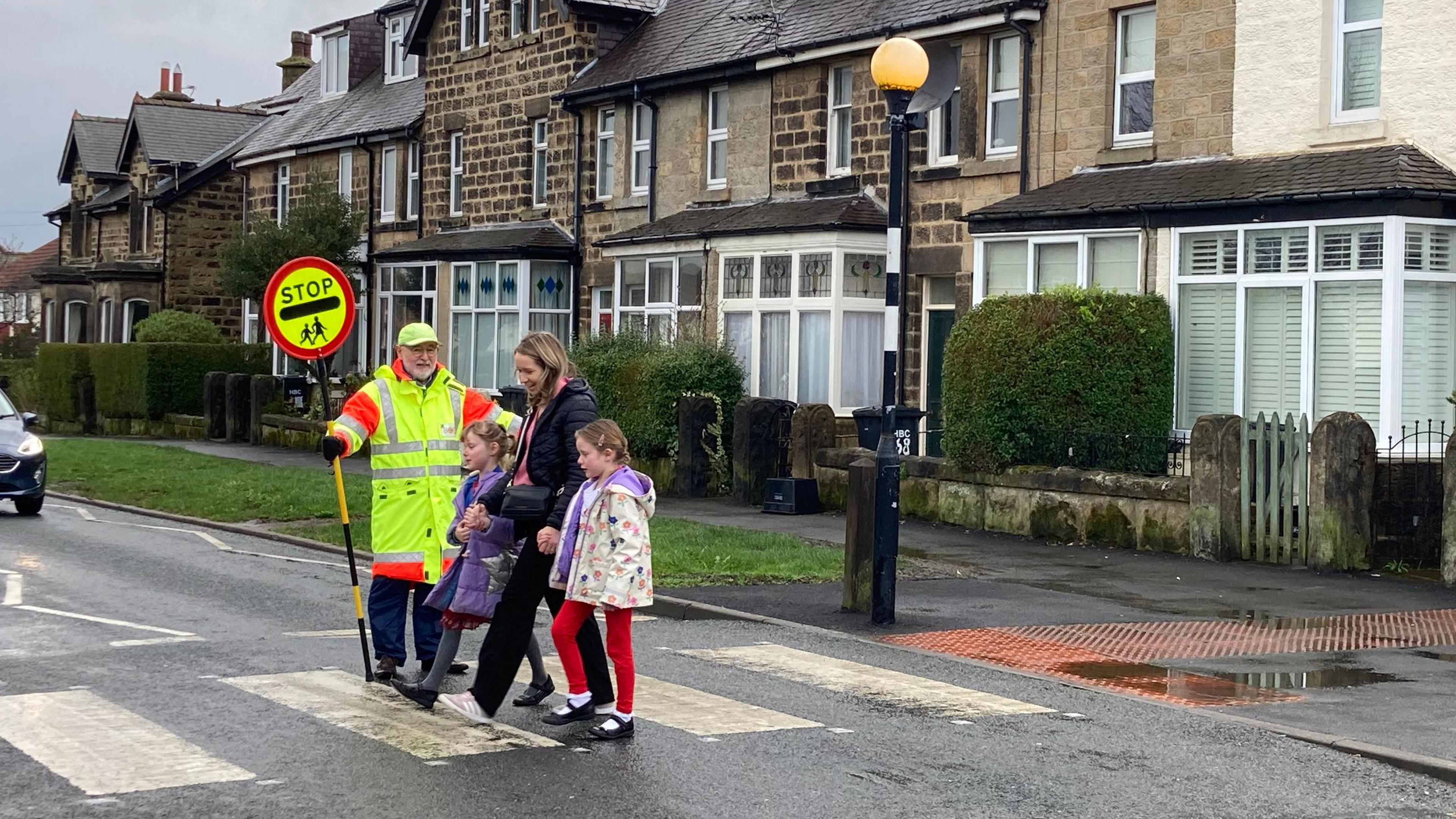 Bob O'Neill show mum and two children across the road