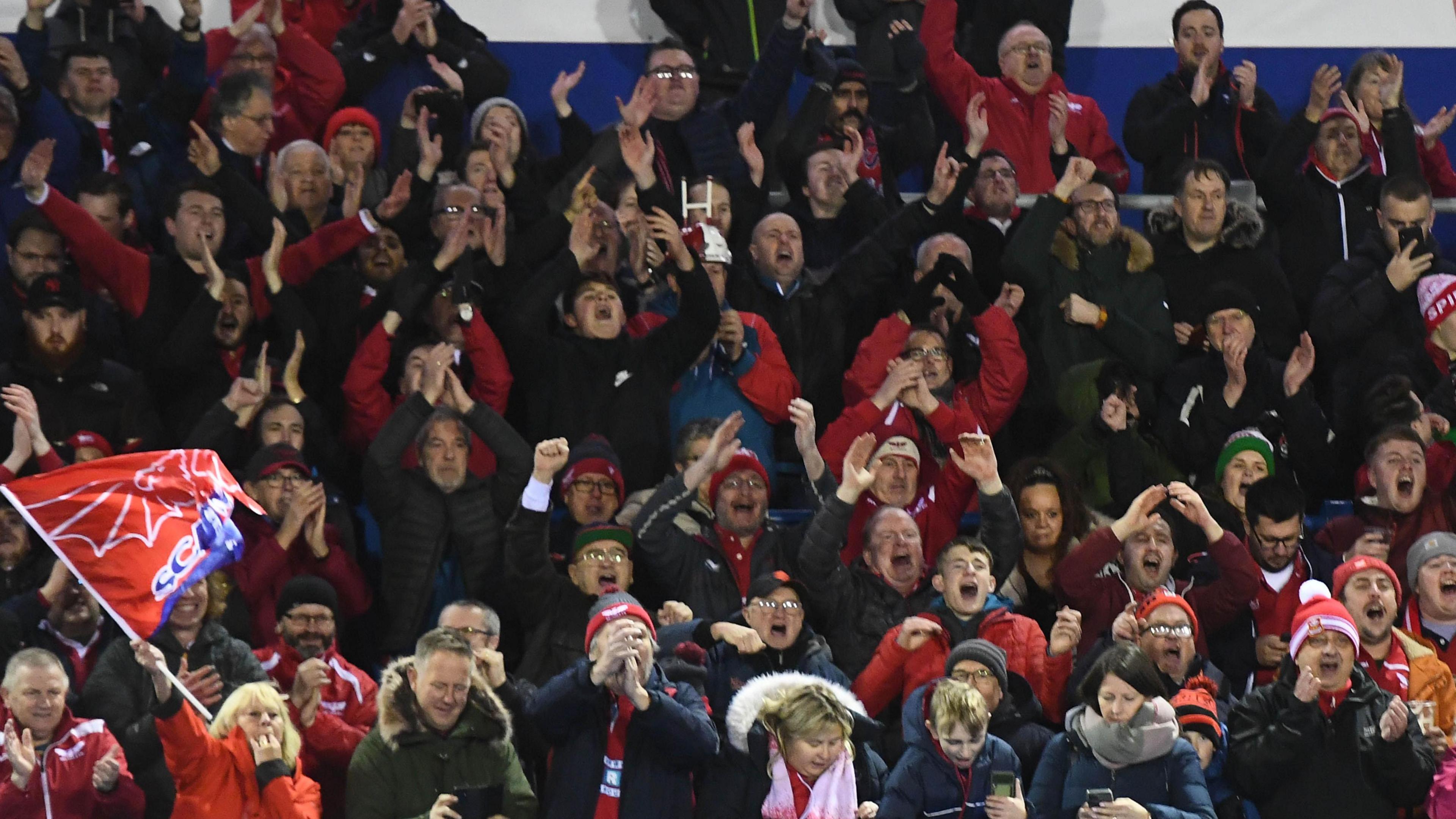 Scarlets supporters cheer on their side against Cardiff