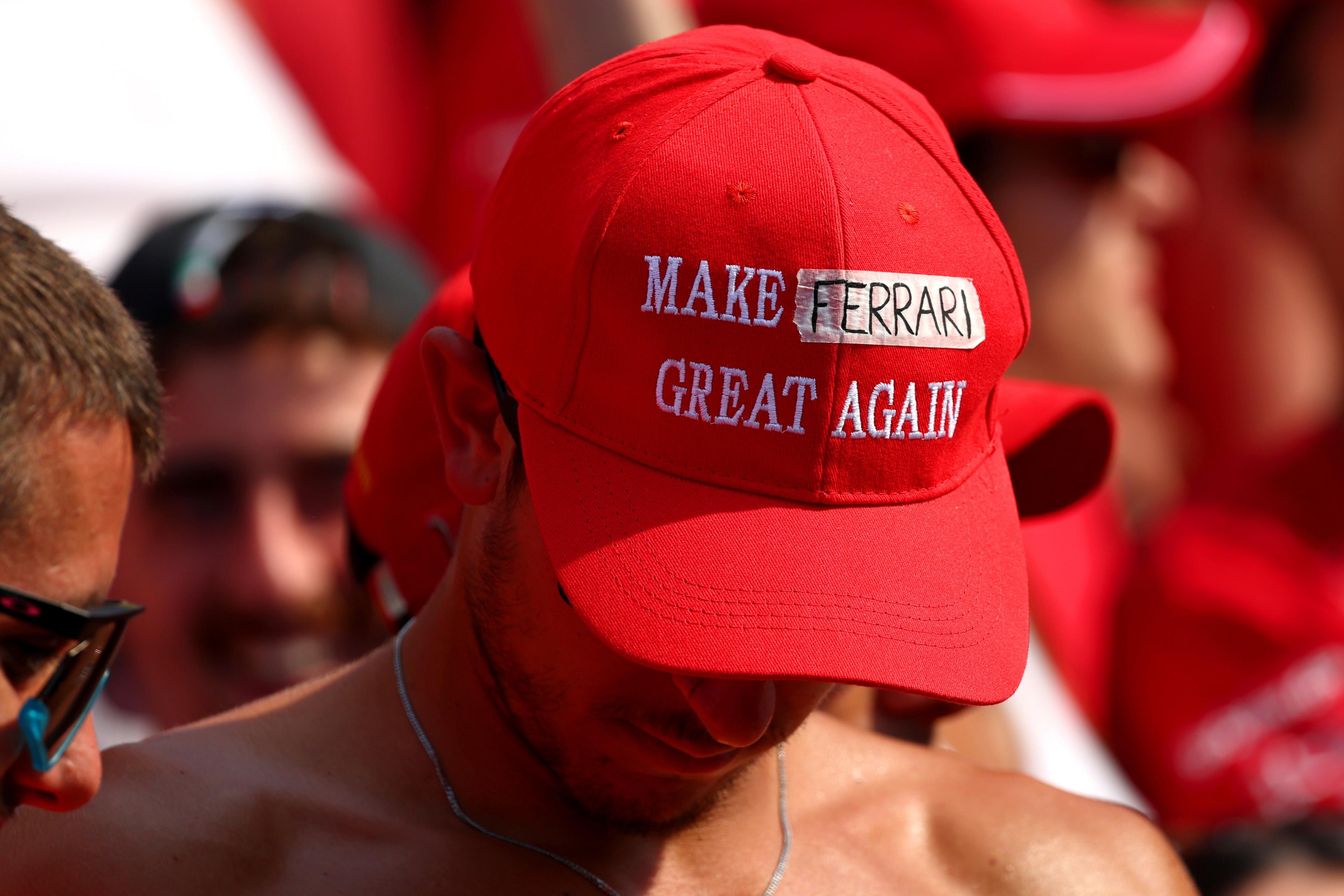 A fan wears a Make Ferrari Great Again cap prior to the F1 Grand Prix of Italy at Autodromo Nazionale Monza. Photo by Clive Rose