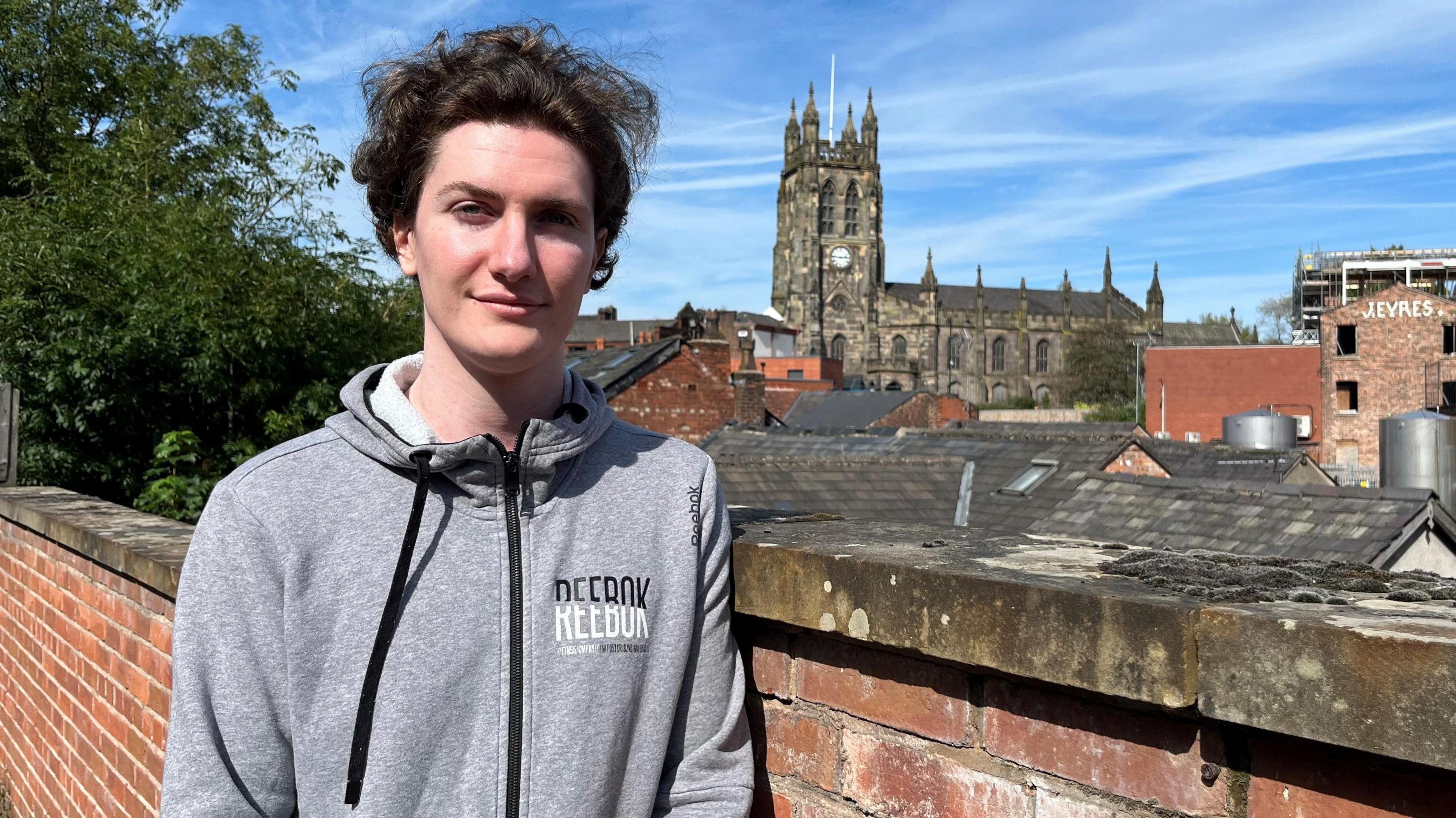 Sam Fallen Nutt with a view overlooking St Mary's Church in Stockport