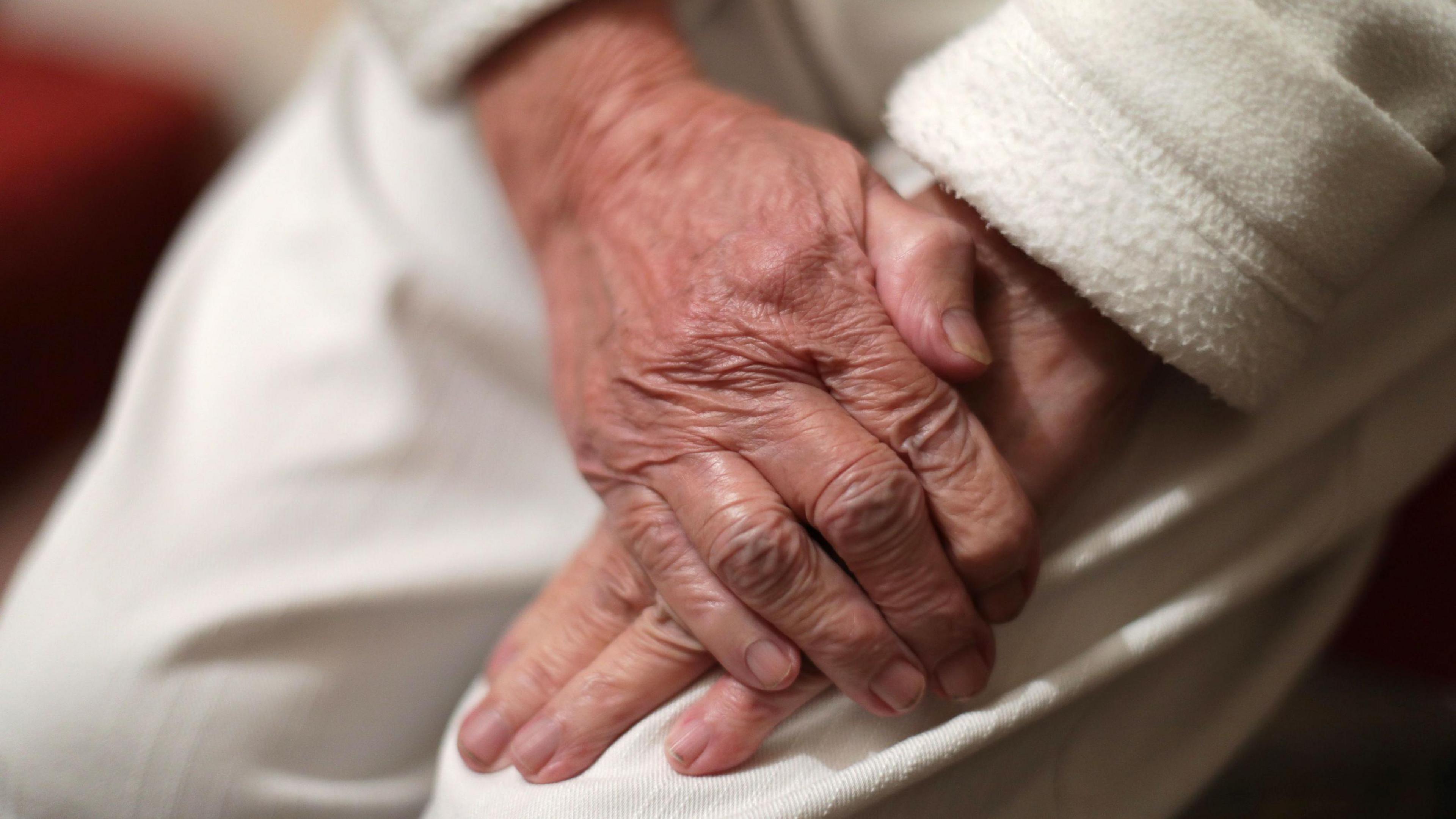 Photo showing hands of a care home patient 