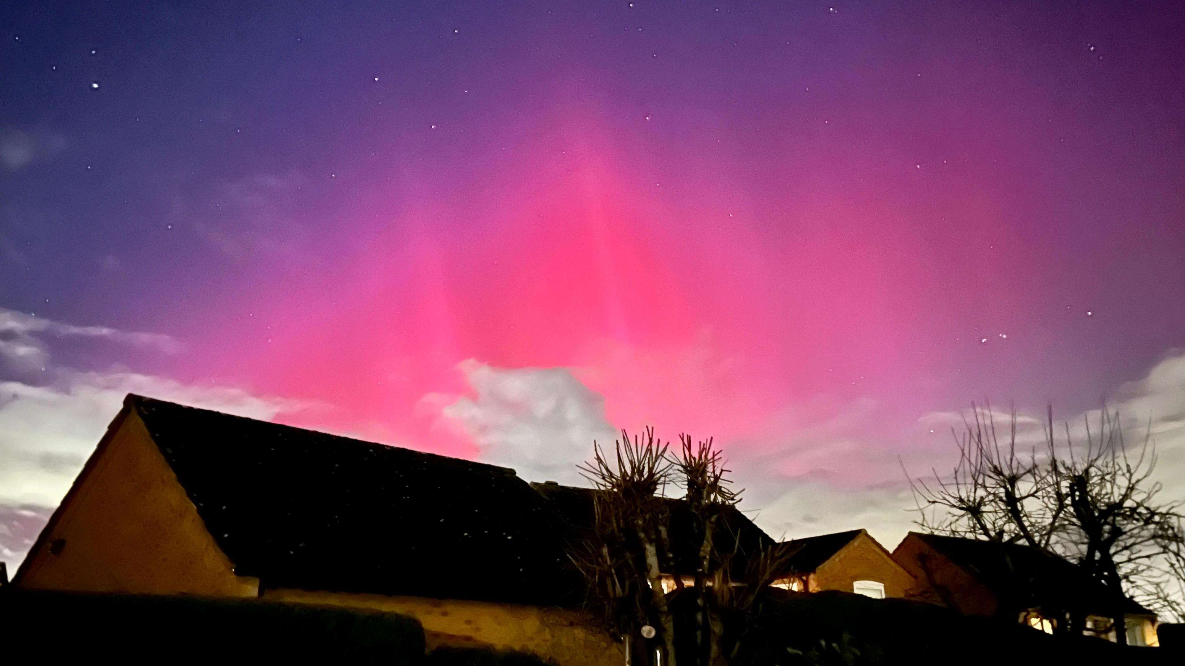 Pink northern lights over Newtown Linford in Leicestershire