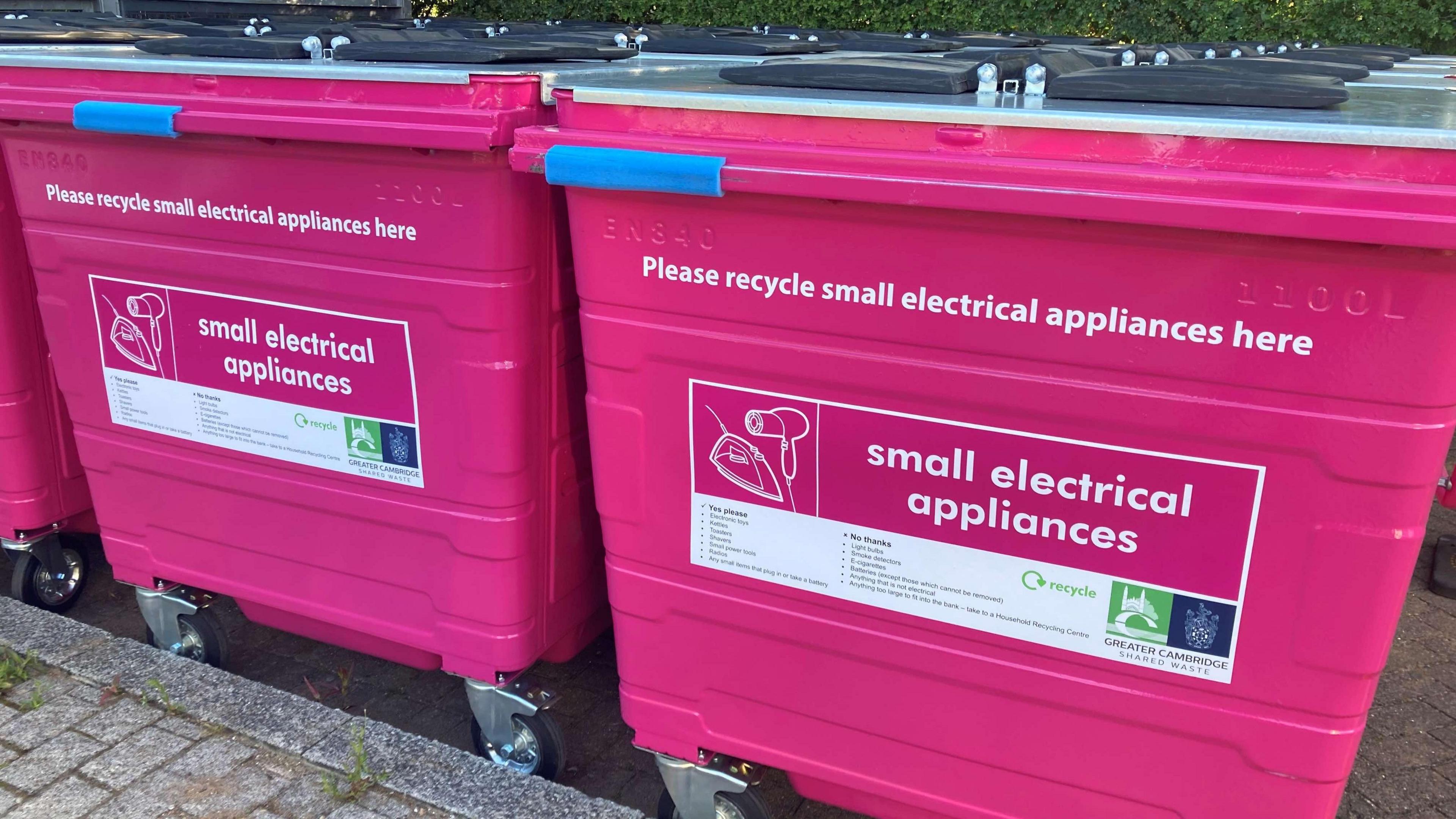 Two pink bins