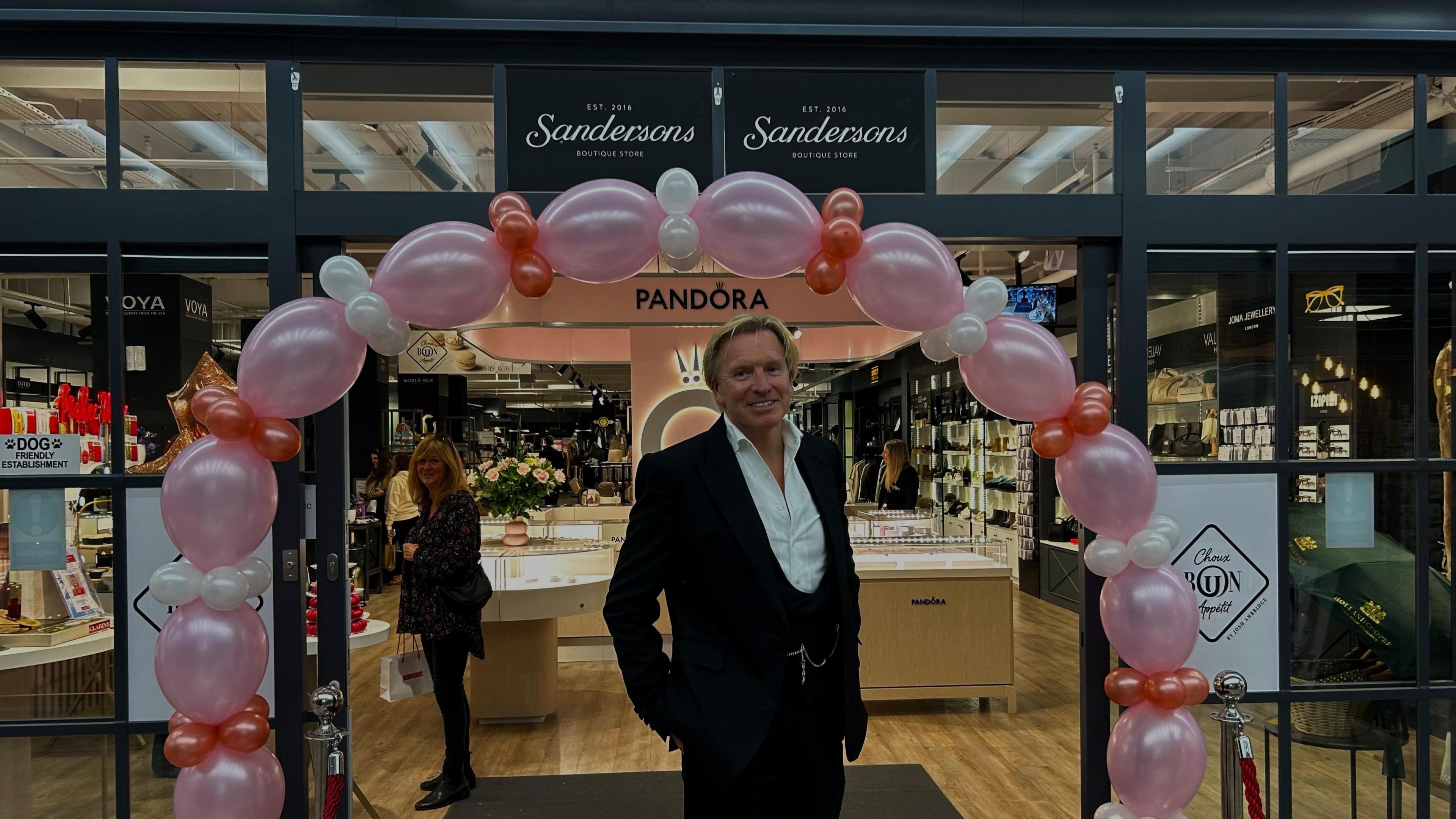 Mark Dransfield stood in front of Sanderson's Boutique Store in the Five Valleys Shopping Centre