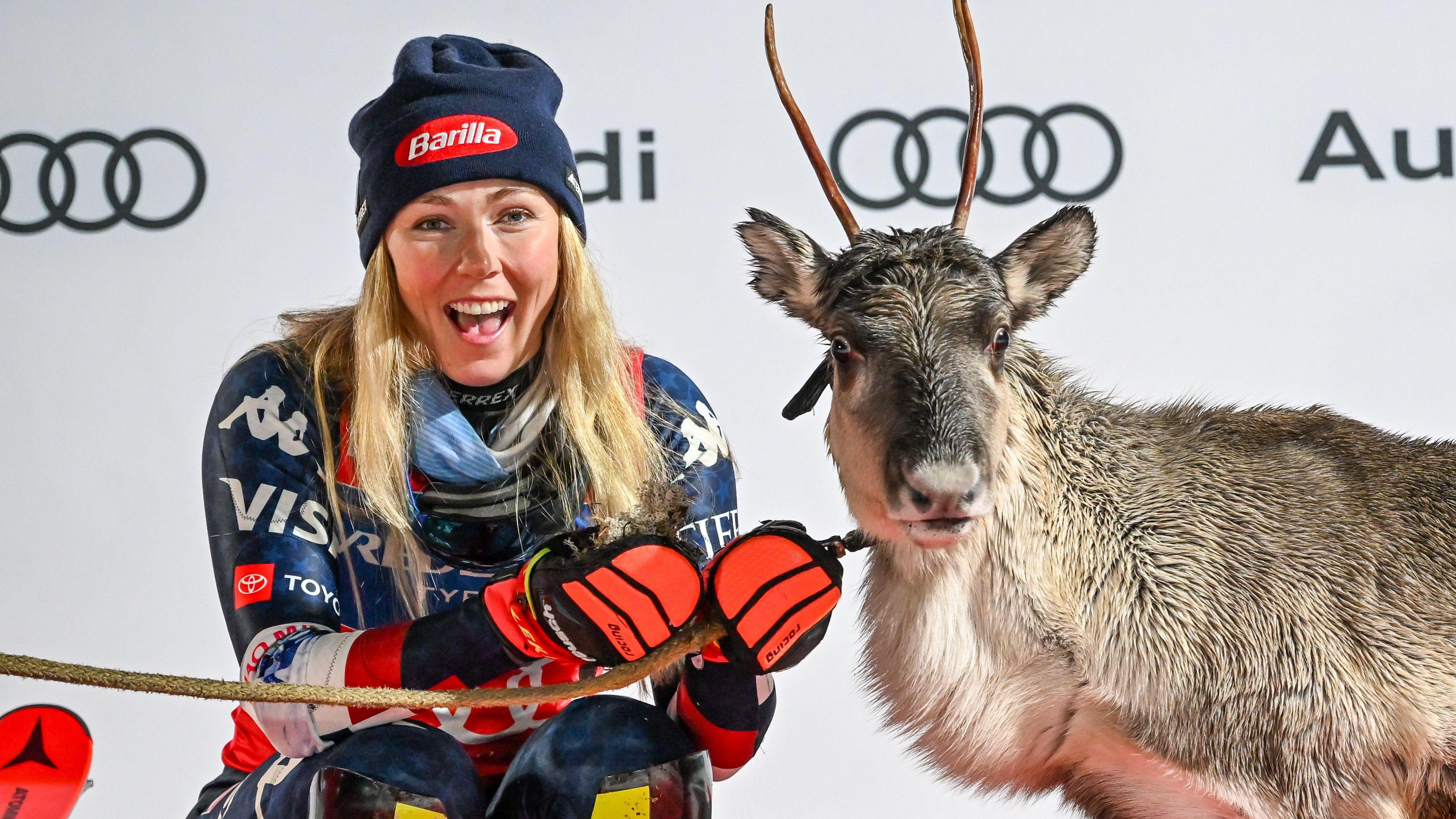 Mikaela Shiffrin of United States with a reindeer after winning in the Women's Slalom race at the FIS Ski World Cup in Levi, Finland