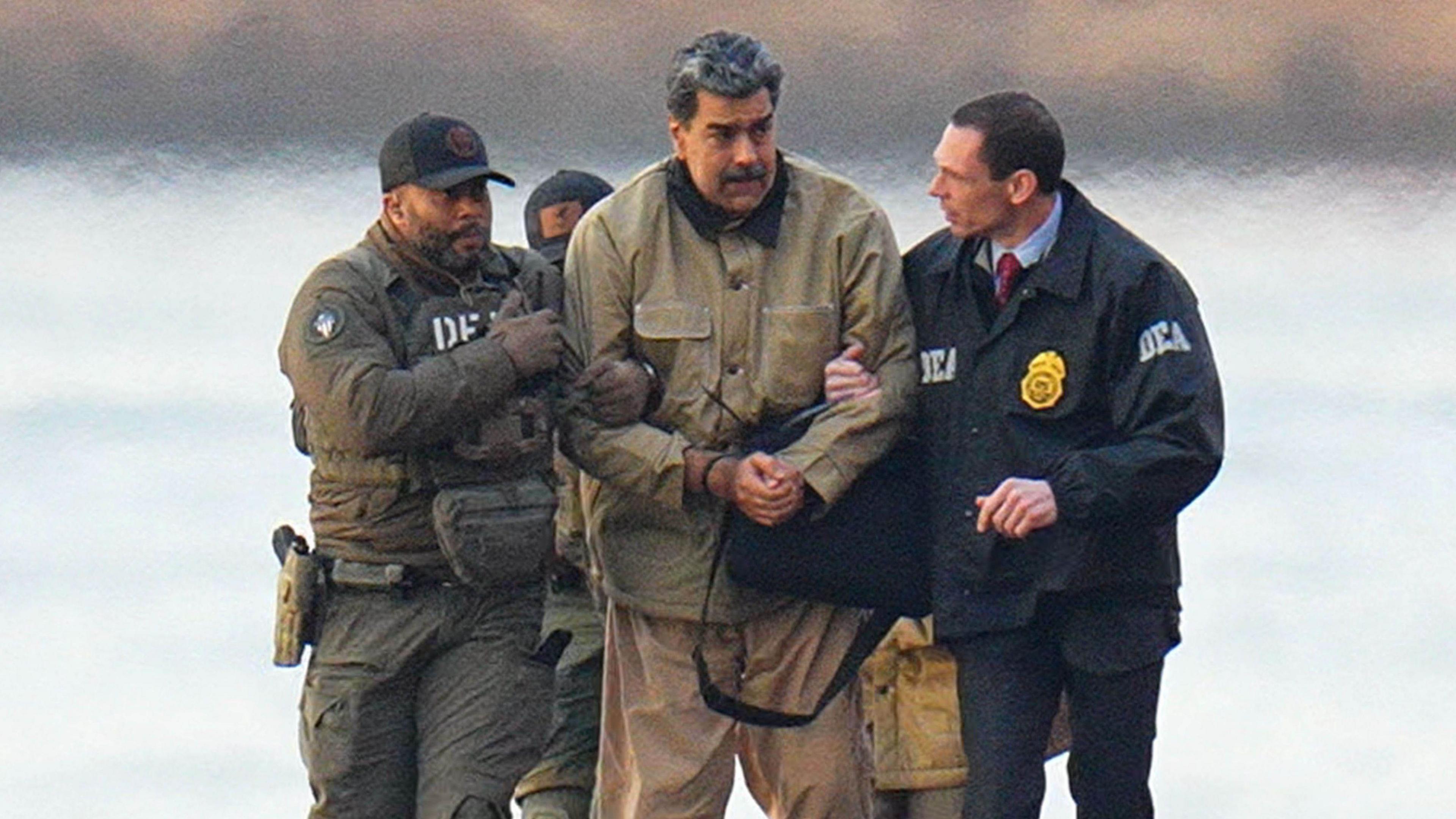 Nicolas Maduro is transported by US security personnel following his capture