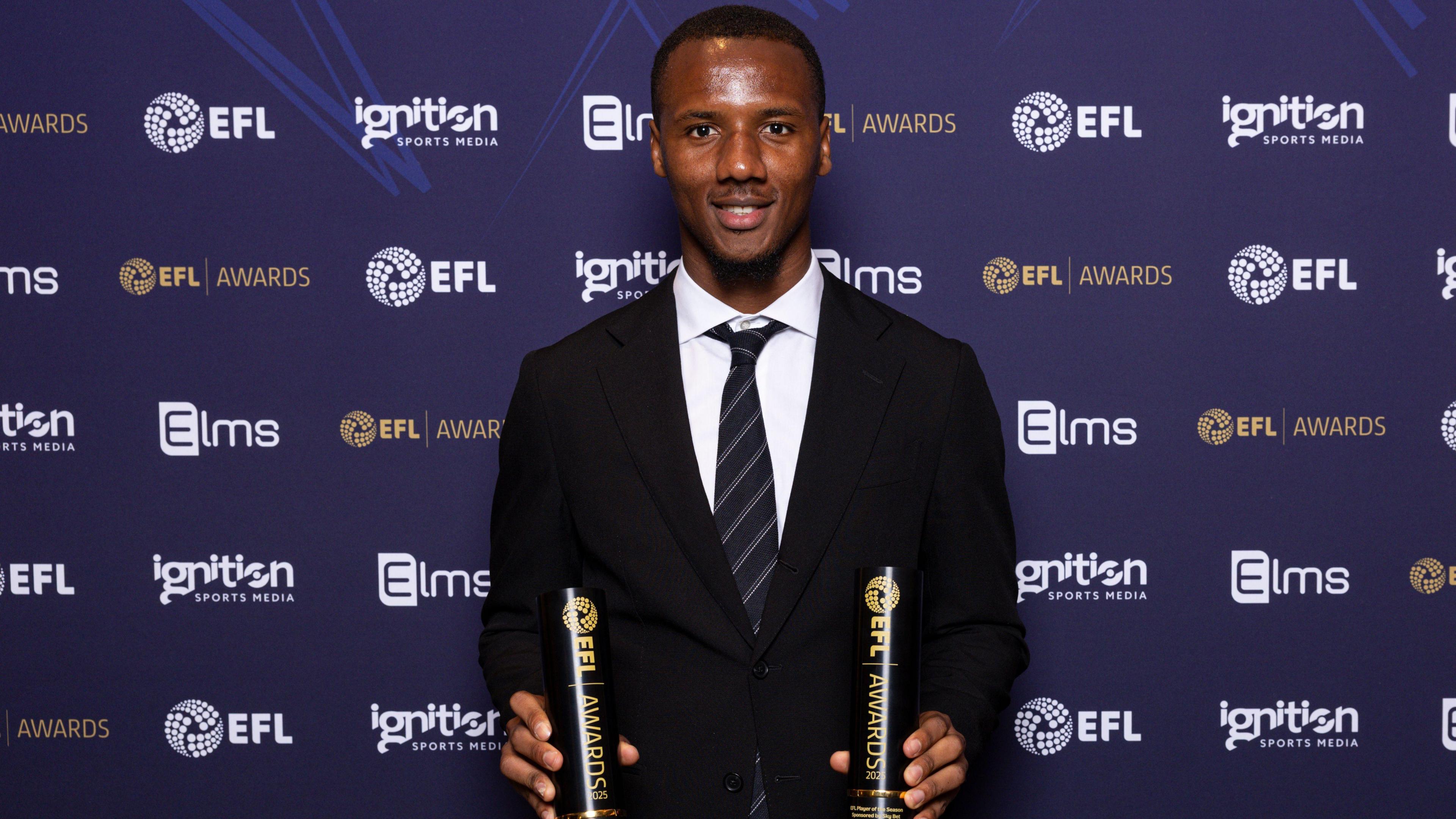 Richard Kone with the 2024-25 League One player and young player of the year trophies at the EFL Awards in April 2025 