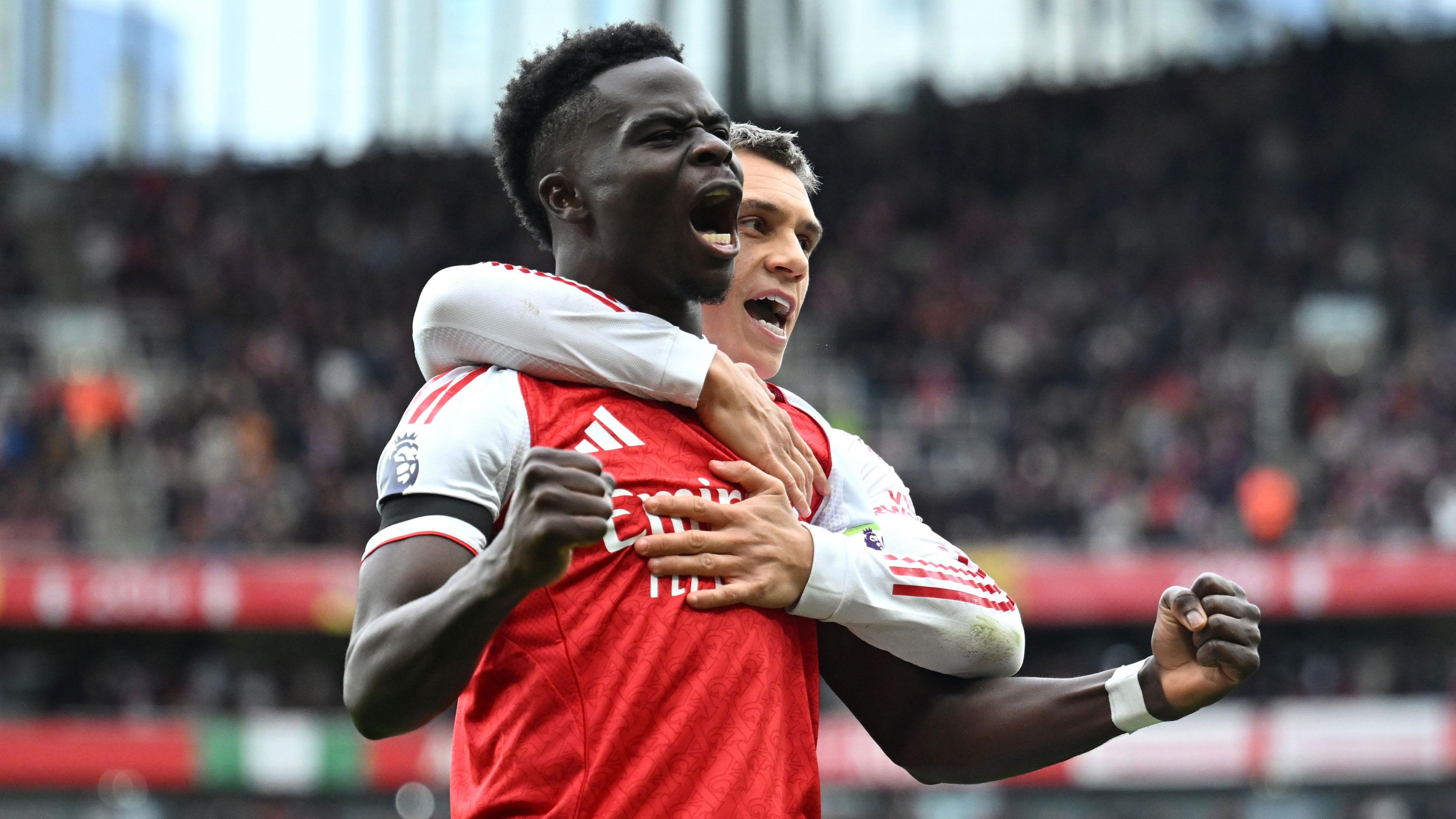Bukayo Saka celebrates