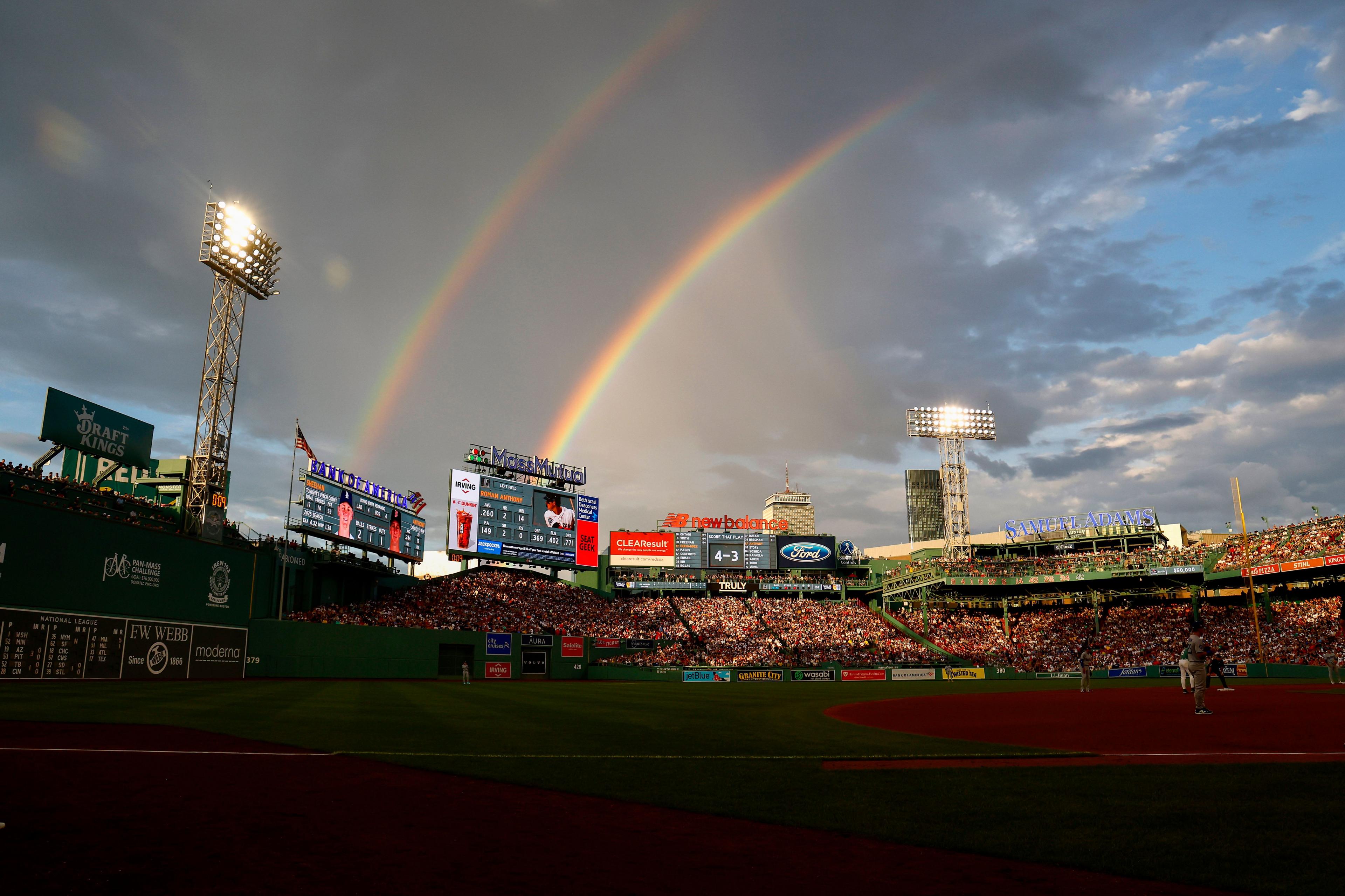 A double rainbow is seen over Fenway Park during the first inning of the game between the Boston Red Sox and the Los Angeles Dodgers in Boston, Massachusetts. Photo By Winslow Townson