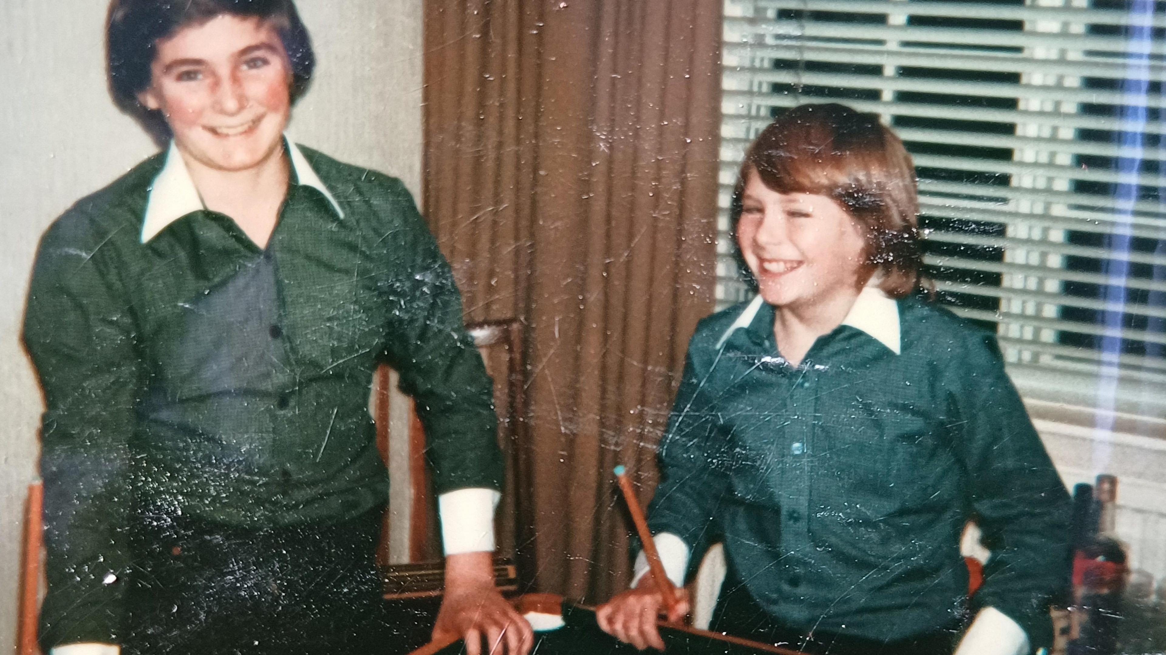 Patrick and Nicky wearing snooker outfits and playing snooker during the school holiday, in their family home in Blackwood 