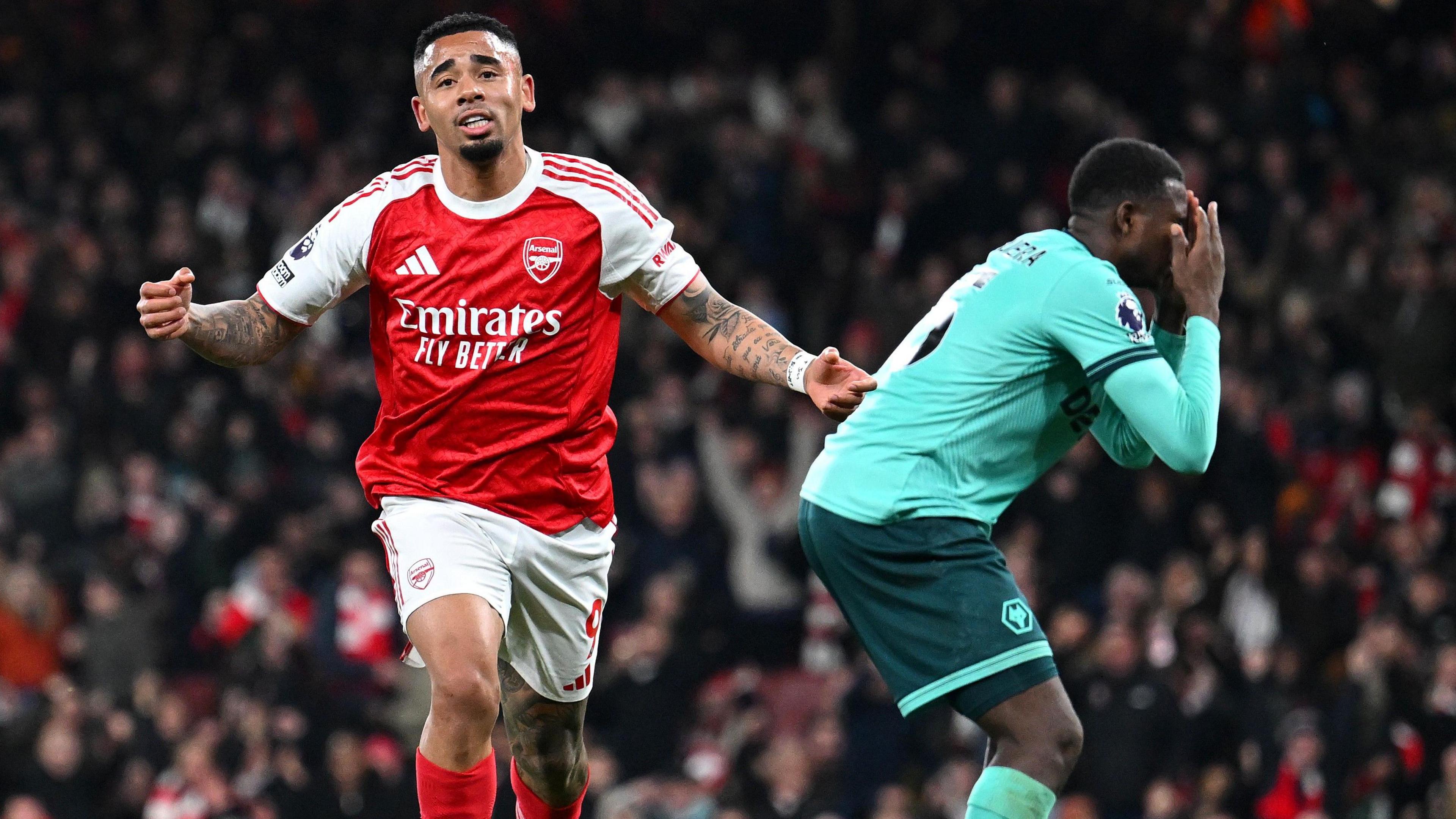 Gabriel Jesus celebrates as Yerson Mosquera holds his head in his hands 